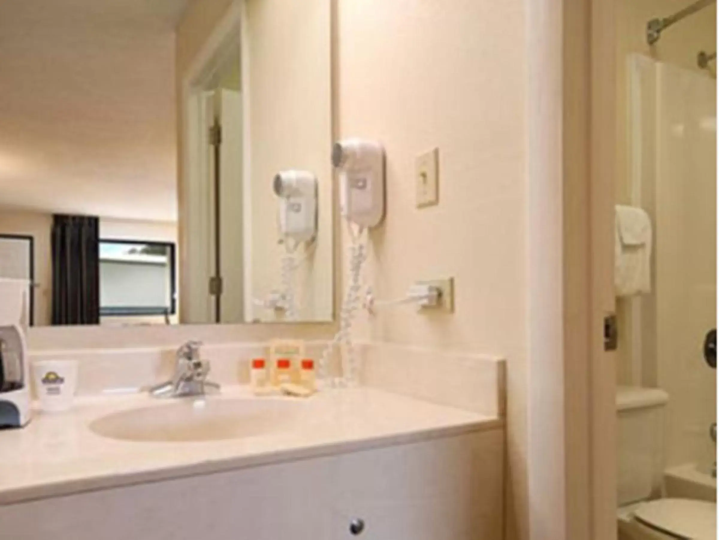 Bathroom in Days Inn by Wyndham Enterprise