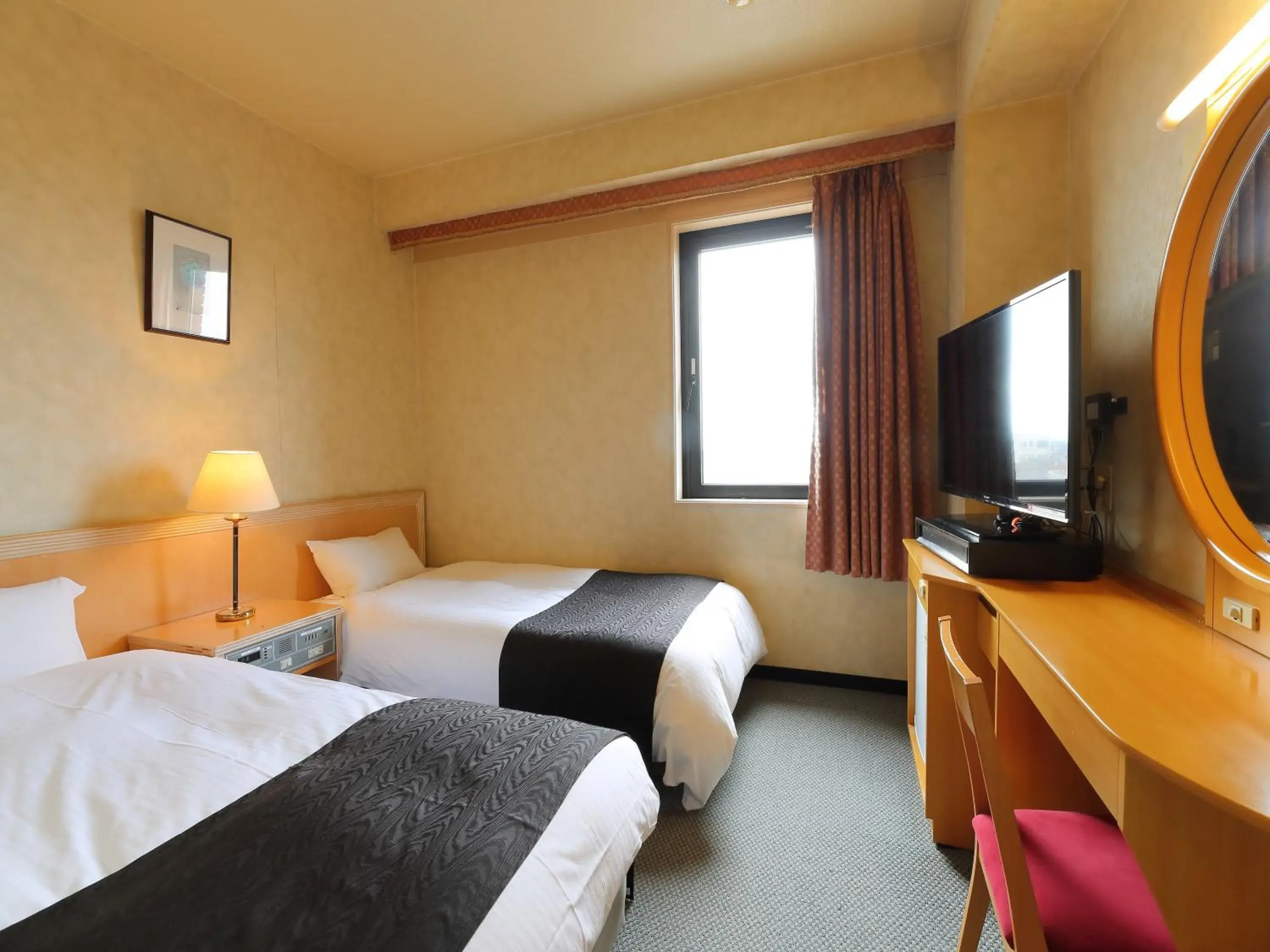Photo of the whole room, Bed in Apa Hotel Tonami-Ekimae