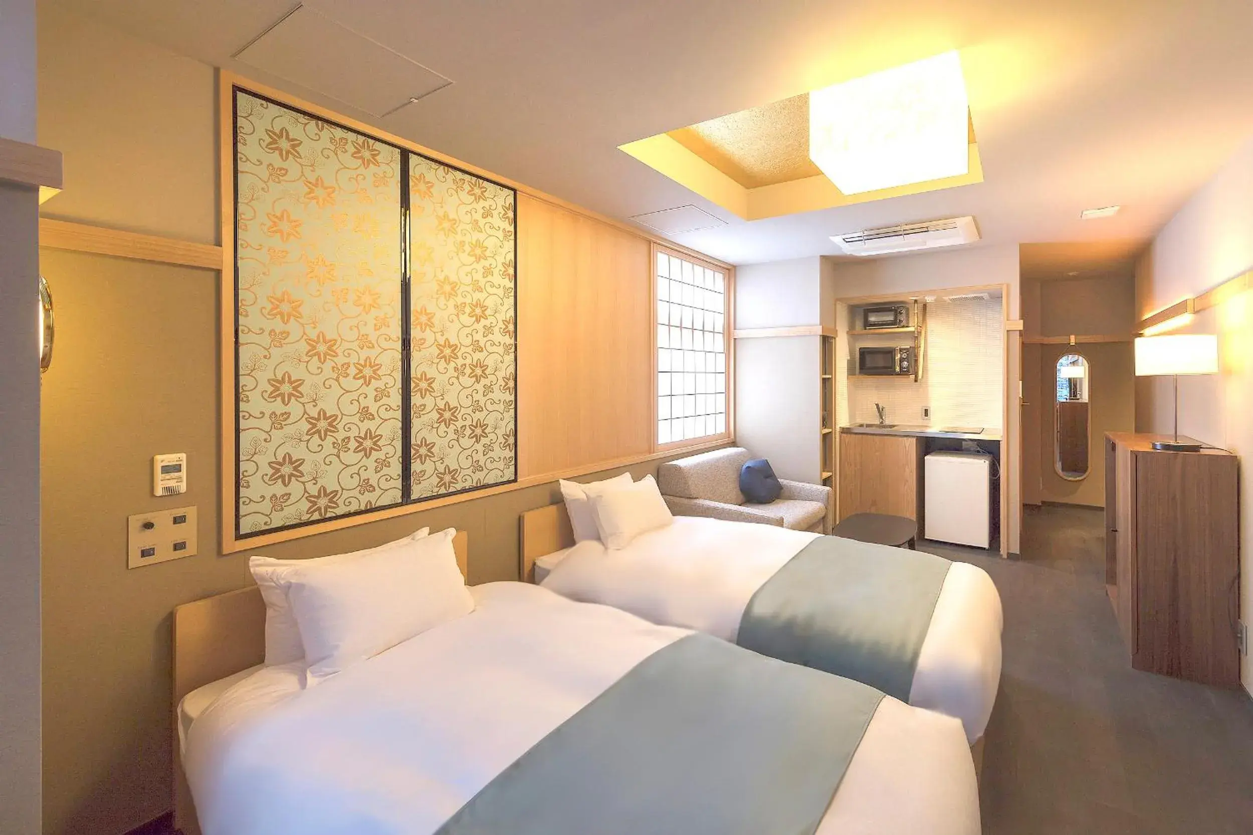 Kitchen or kitchenette, Bed in Gozan Hotel & Serviced Apartment Higashiyama Sanjo