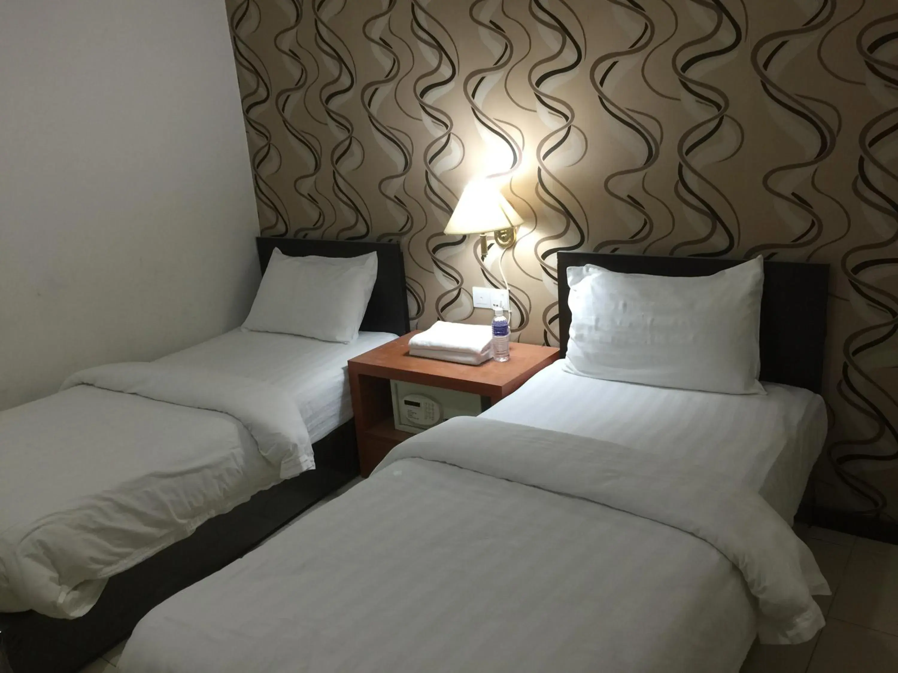 Bed in Permai Hotel