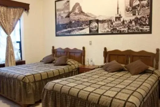 Bed in Hotel Don Porfirio