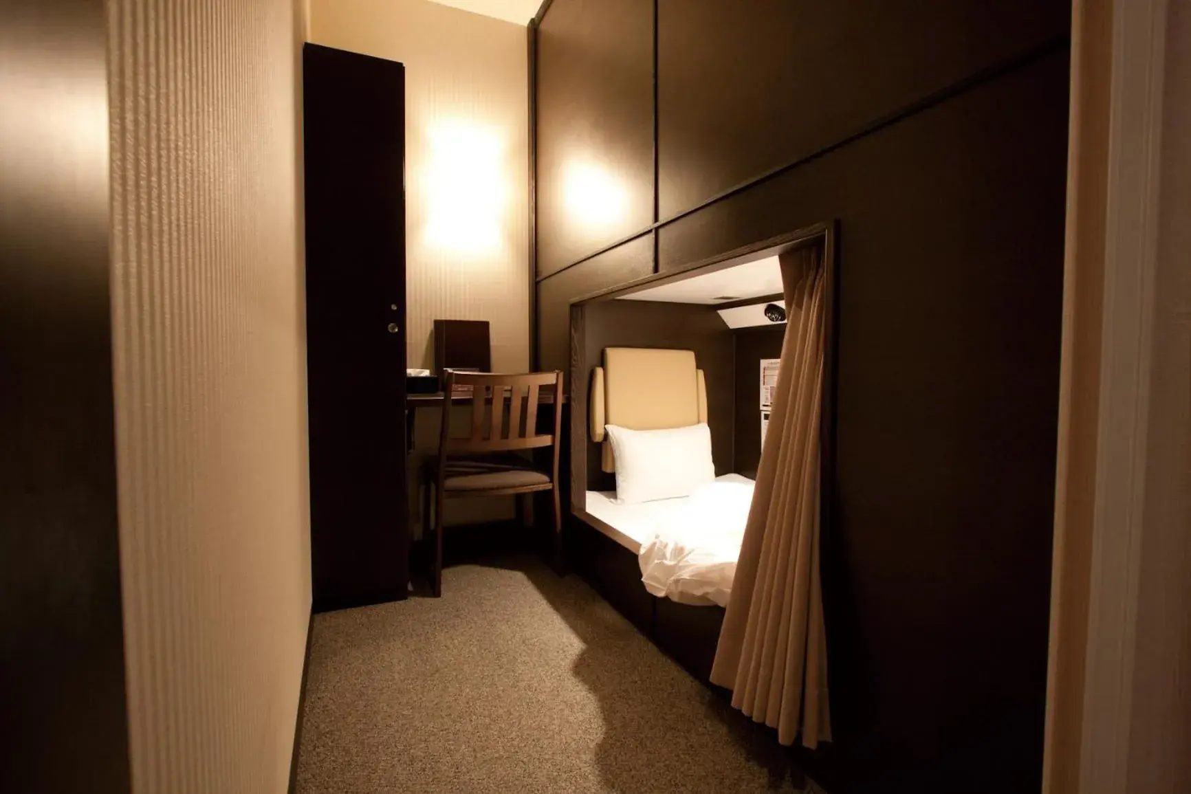 Bedroom, Bed in HEARTS Capsule Hotel & Spa Nakasu -Male only- Bedroom, Bed in HEARTS Capsule Hotel & Spa Nakasu -Male only-