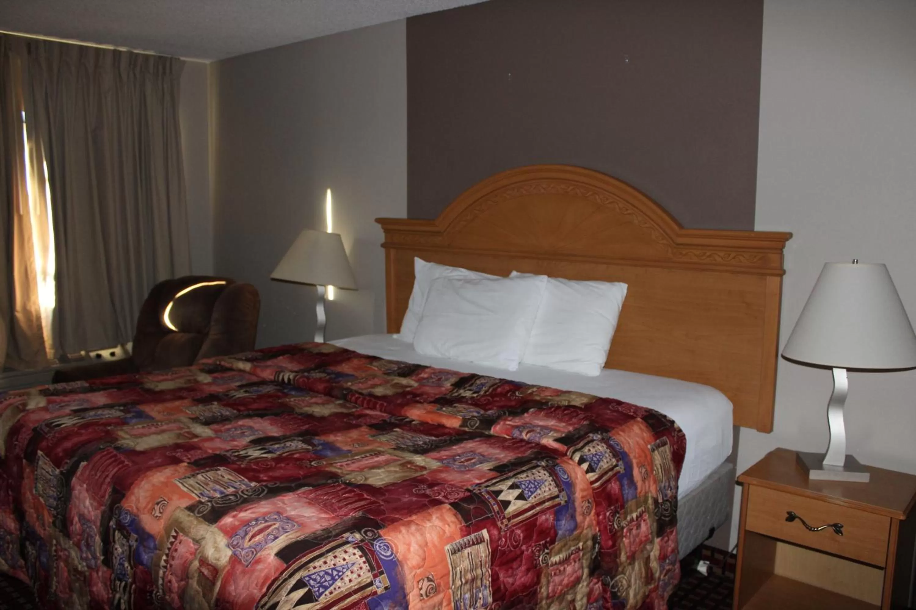 Bedroom, Bed in Coratel Inn and Suites Maple Grove