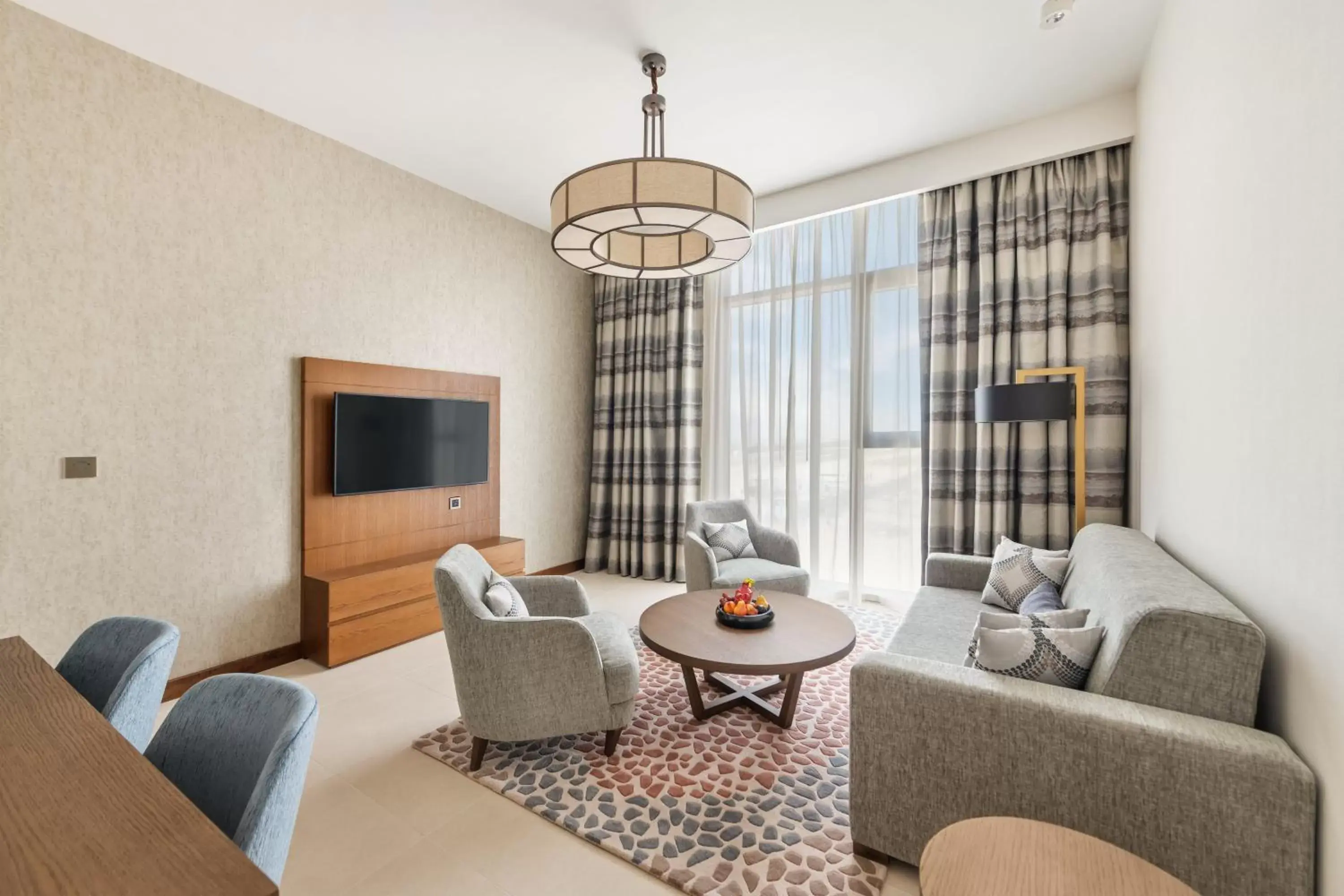 Bedroom, Seating Area in Staybridge Suites Dubai Al-Maktoum Airport, an IHG Hotel