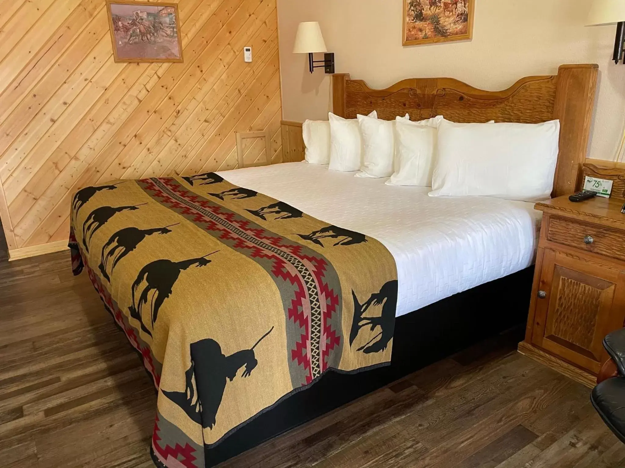 Bed in The Longhorn Ranch Lodge & RV Resort
