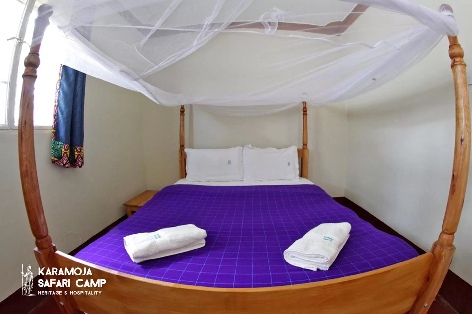 Bed in Kara-Tunga Safari Camp