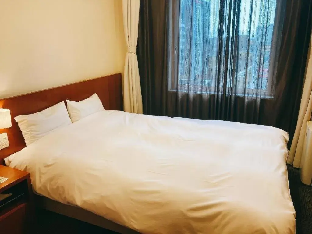 Bed in Dormy Inn Kanazawa Natural Hot Spring