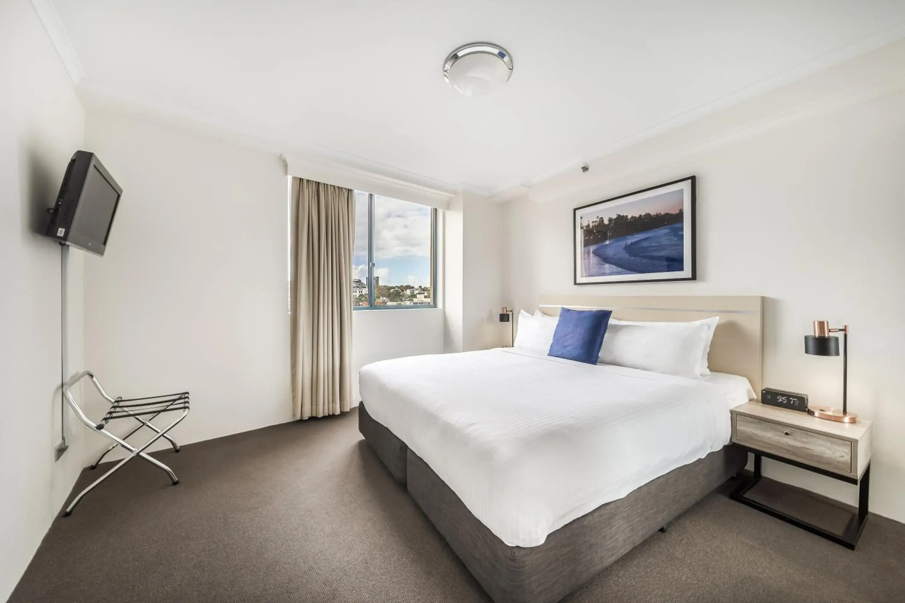 Bed in Oaks Sydney Castlereagh Suites