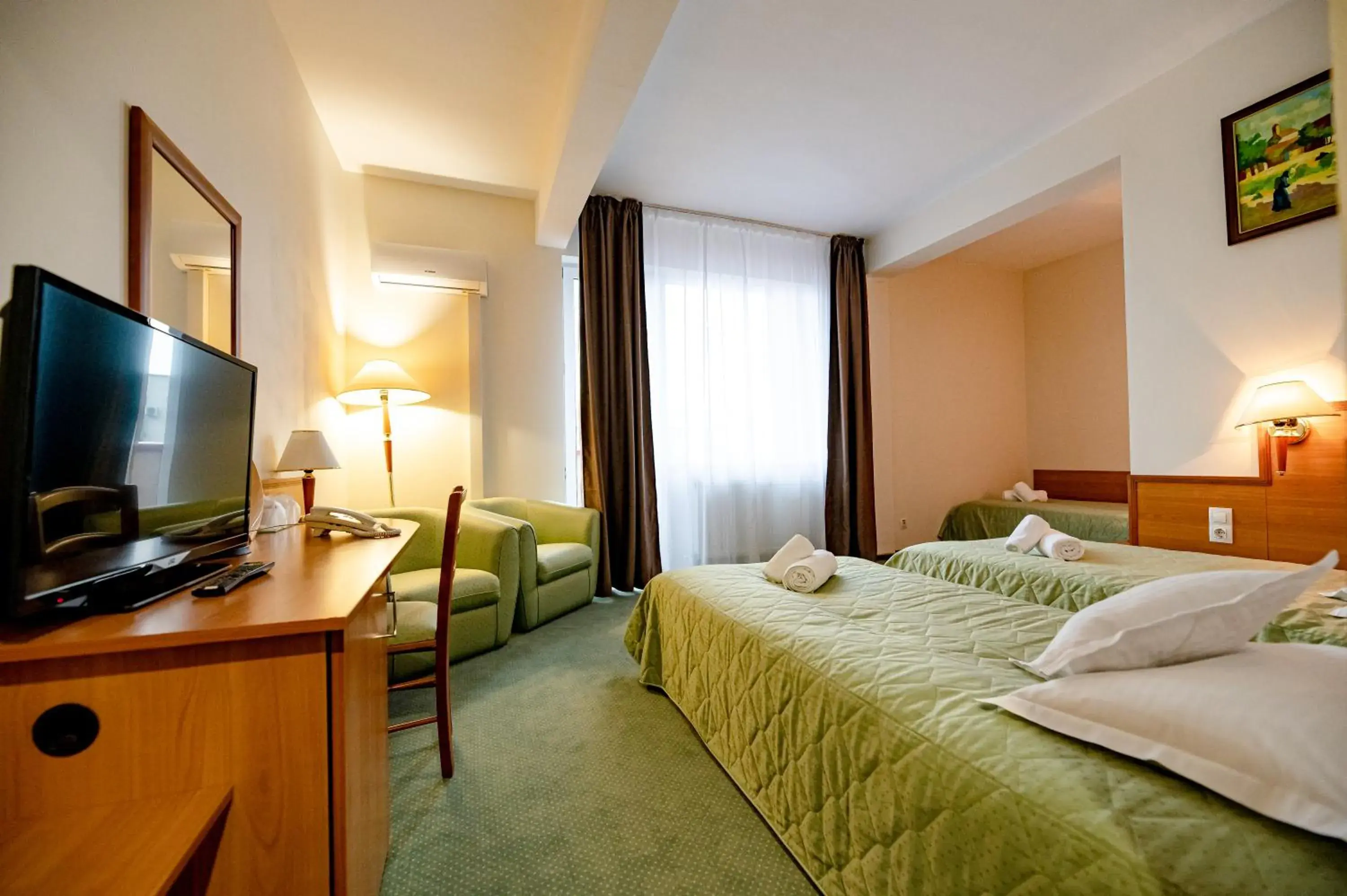 Bed, TV/Entertainment Center in Hotel Rivulus