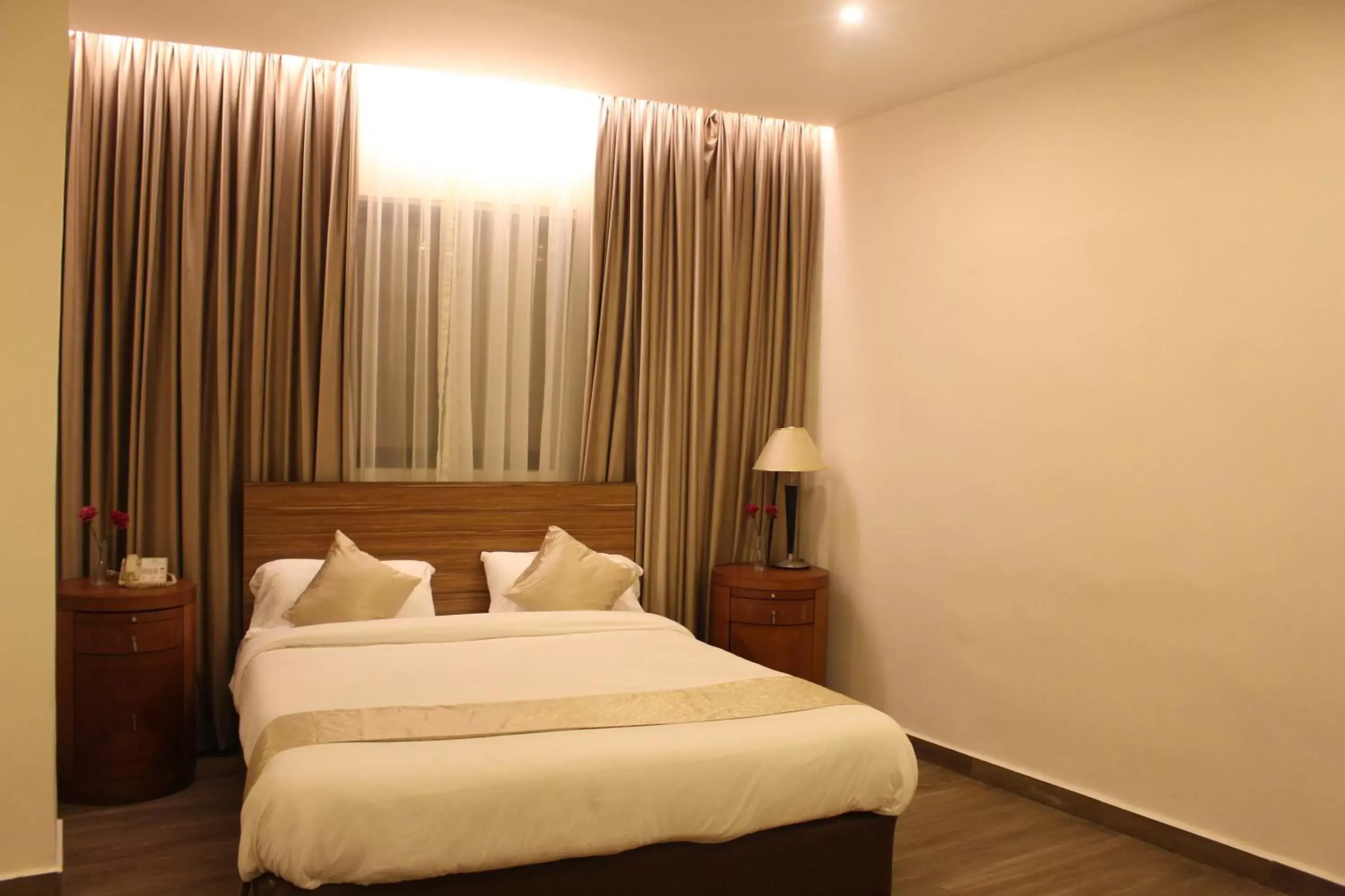 Bed in New MerryLand Hotel Bed in New MerryLand Hotel