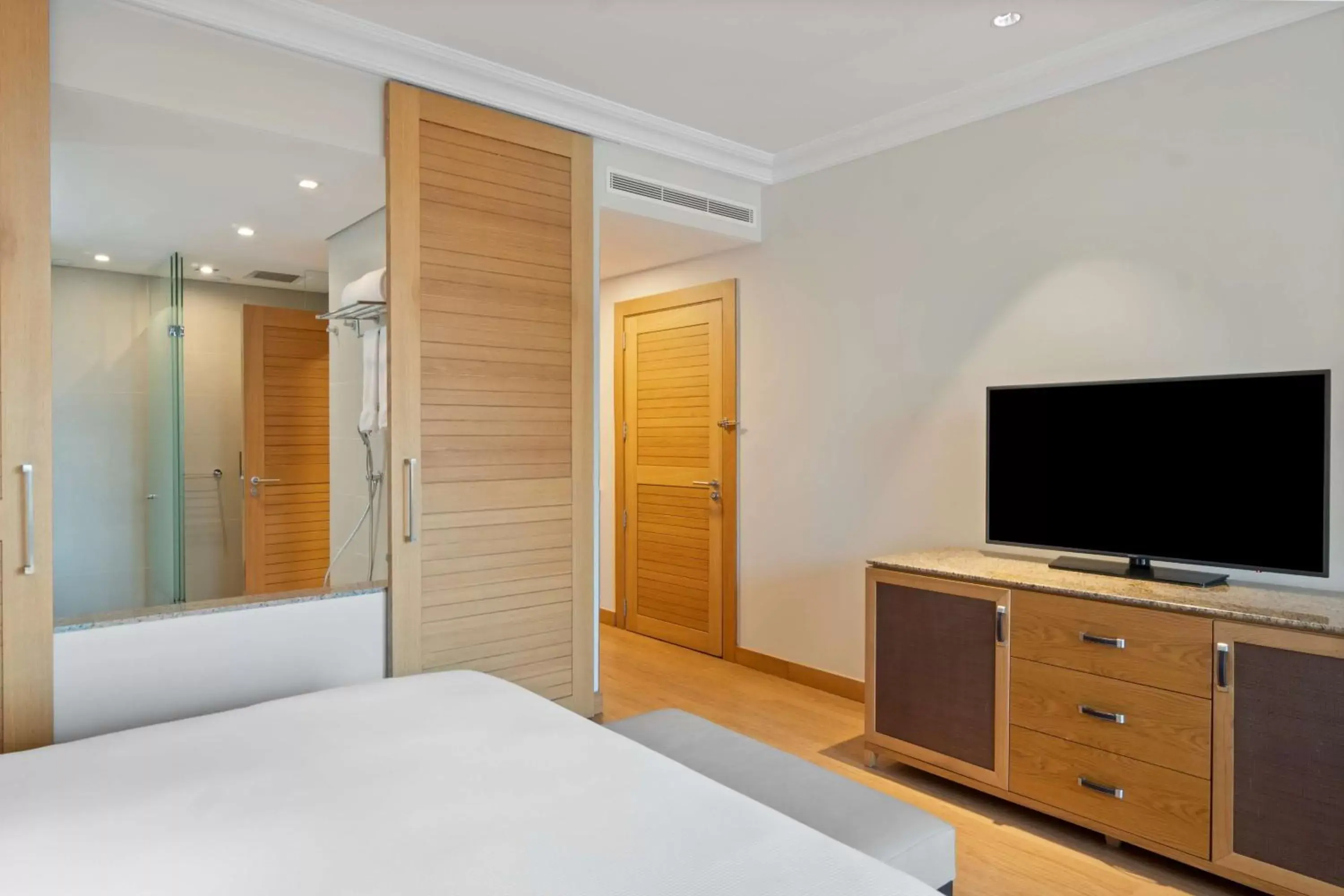 Bed, TV/Entertainment Center in Hilton Cabo Verde Sal Resort