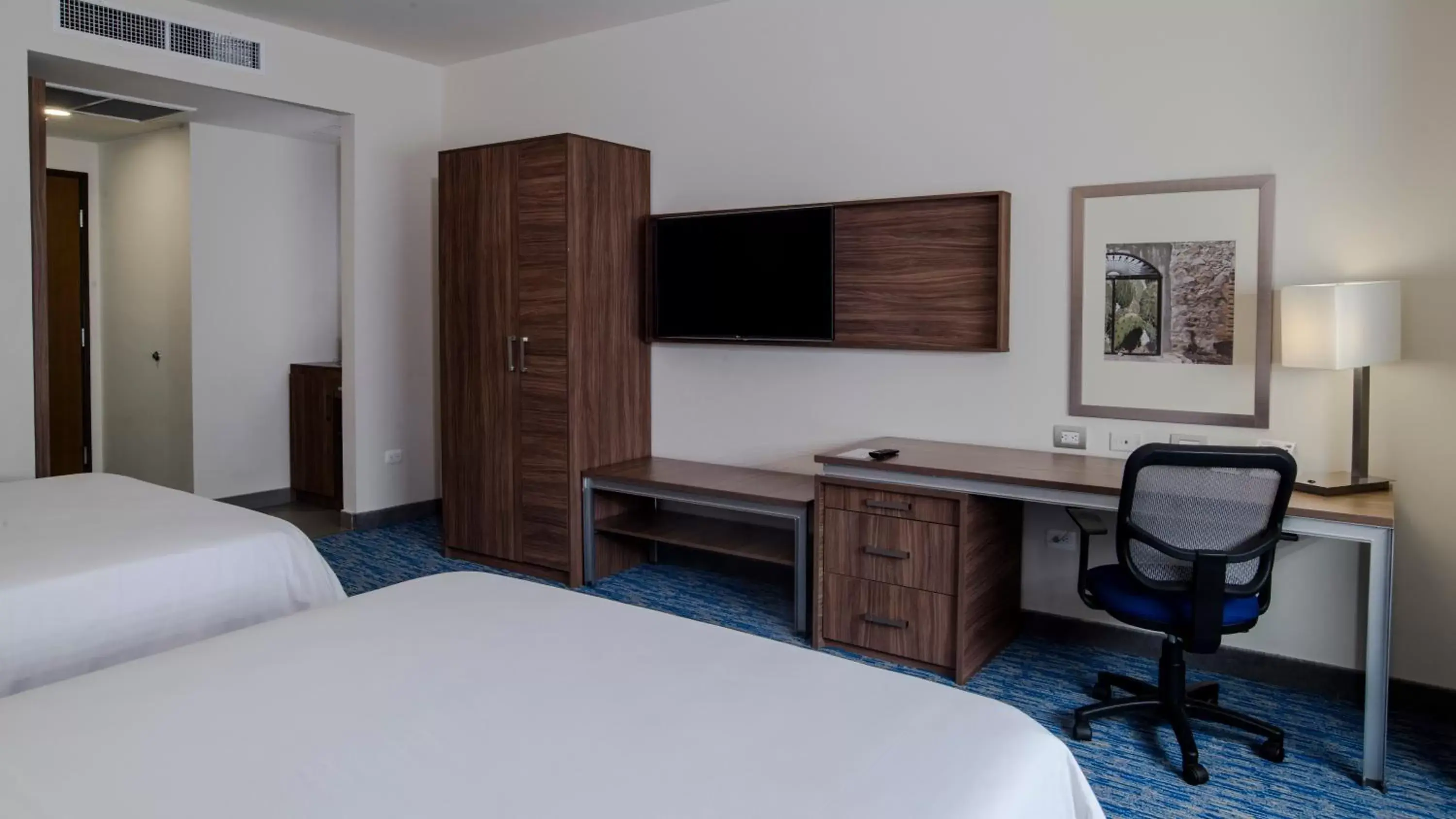 Photo of the whole room, TV/Entertainment Center in Holiday Inn Express & Suites - Ciudad Obregon, an IHG Hotel