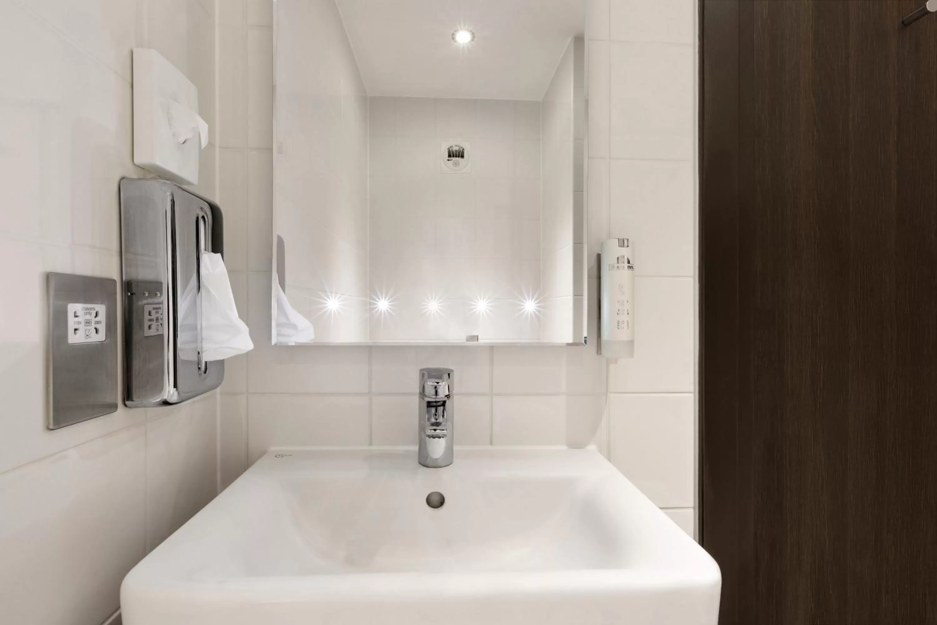 Bathroom in Ramada by Wyndham Cobham