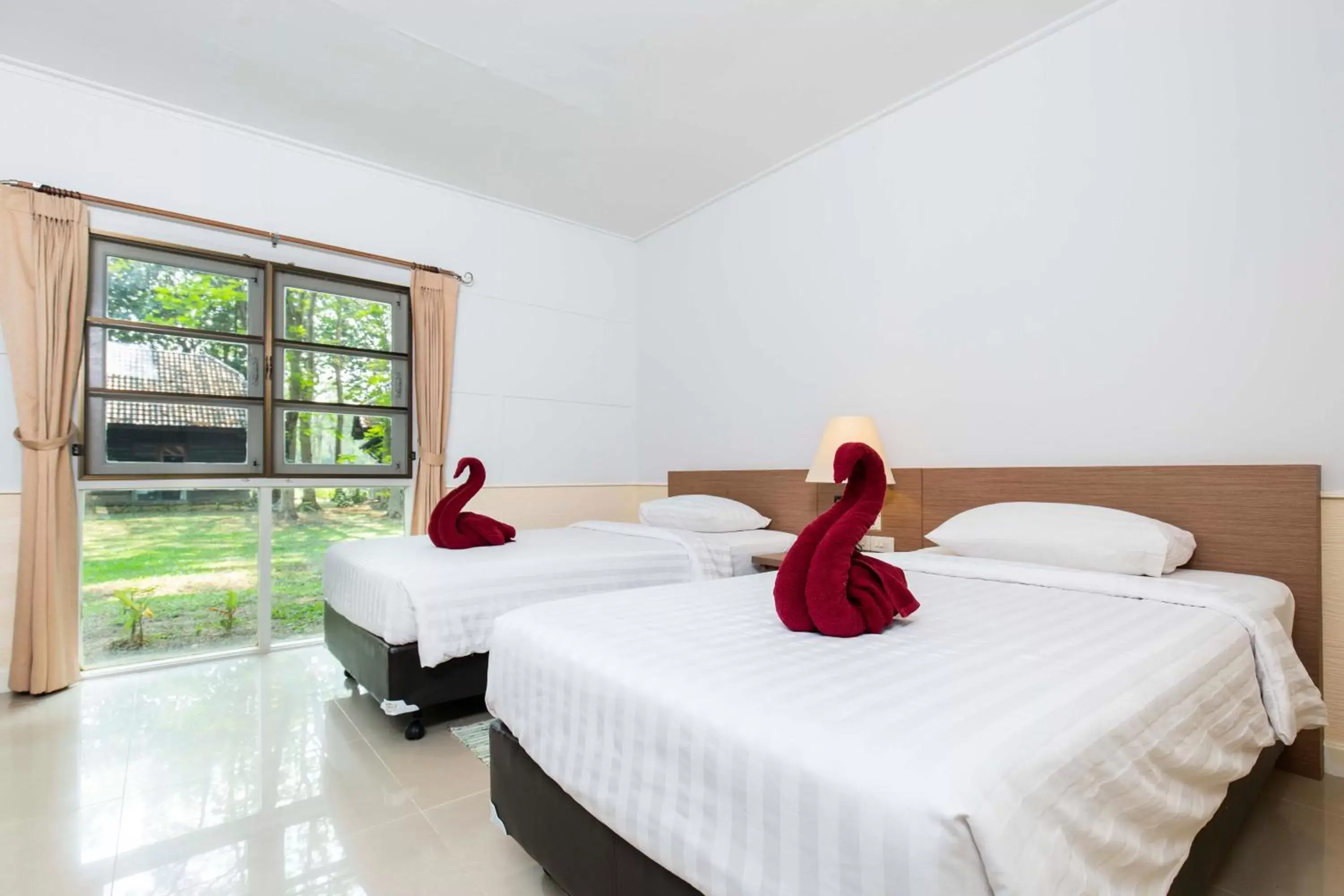 Bed in The Legacy River Kwai Resort Bed in The Legacy River Kwai Resort