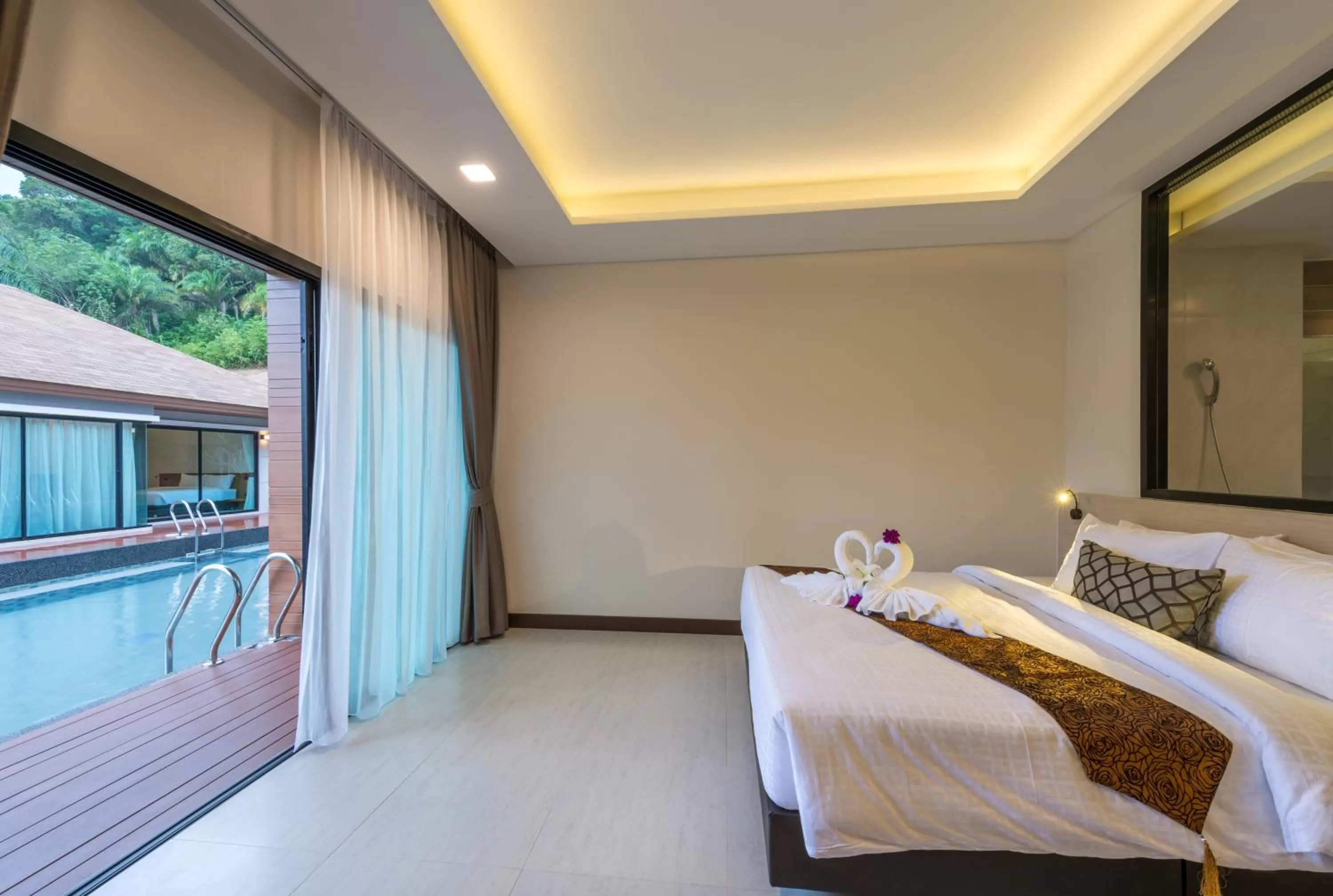 Bed in Cher​mantra​ Aonang​ Resort & Pool​ Suite