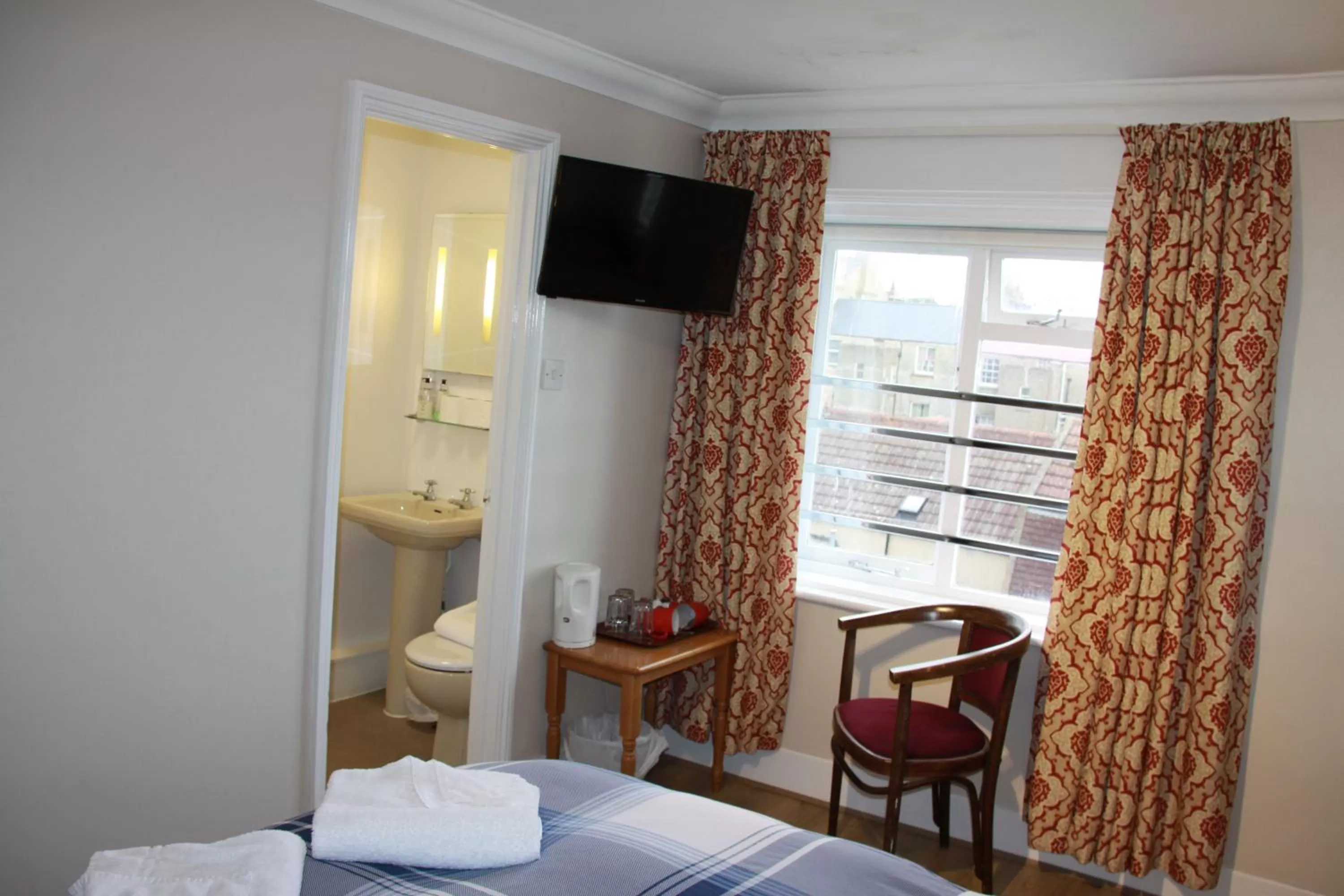 Bed in Ambassador Hotel