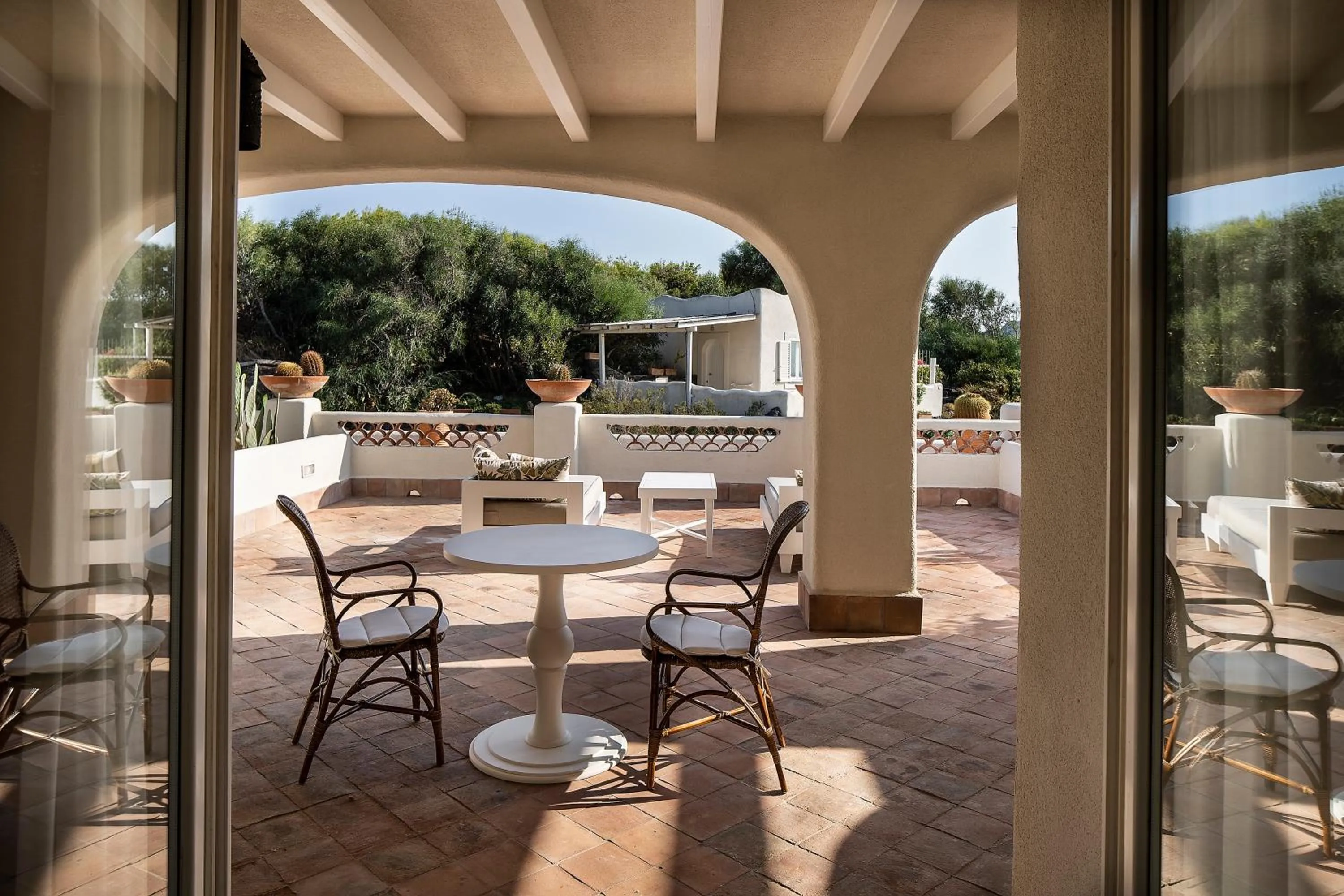 Patio in Therasia Resort Sea and SPA - The Leading Hotels of the World