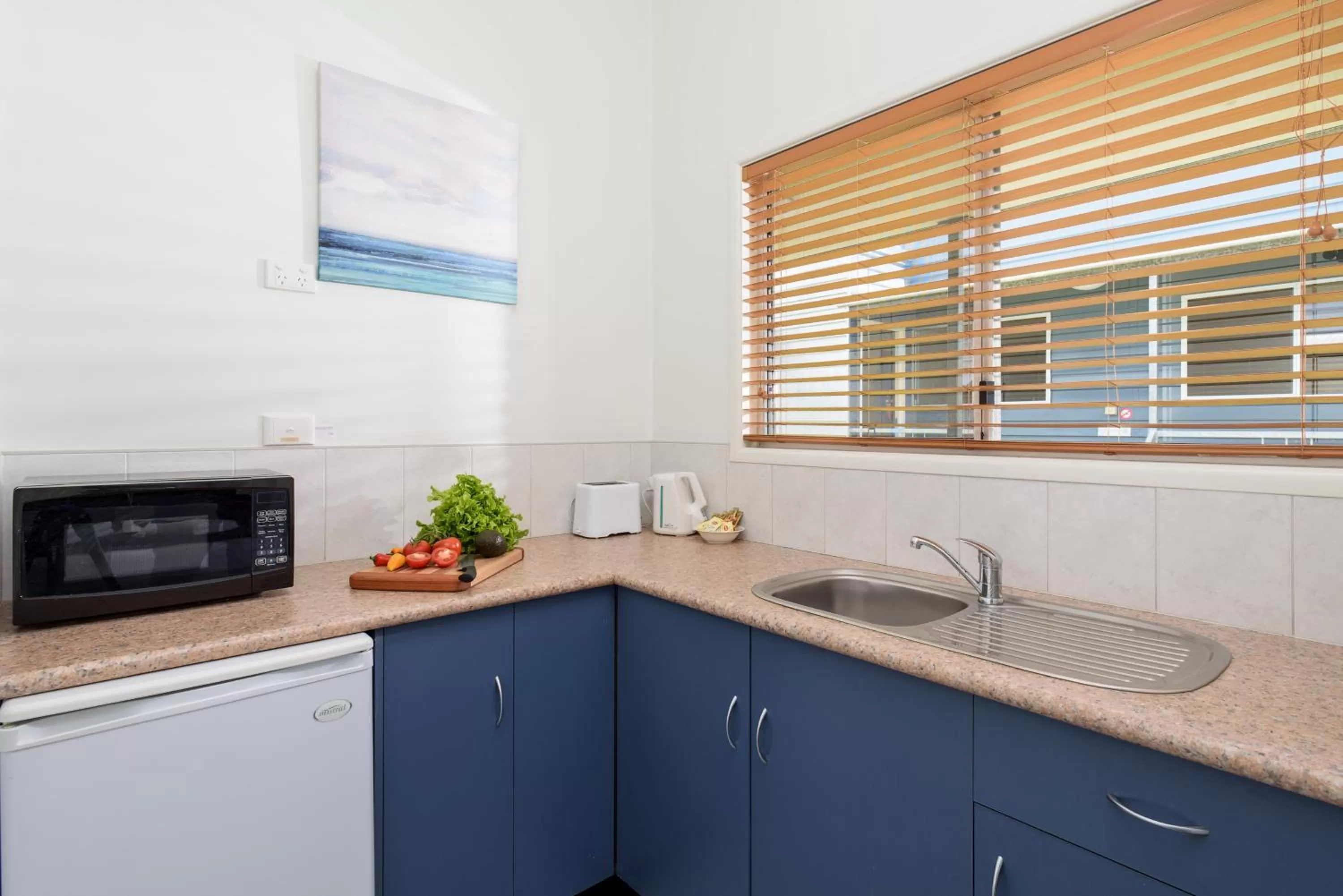 Kitchen or kitchenette in Tin Can Bay's Sleepy Lagoon Motel