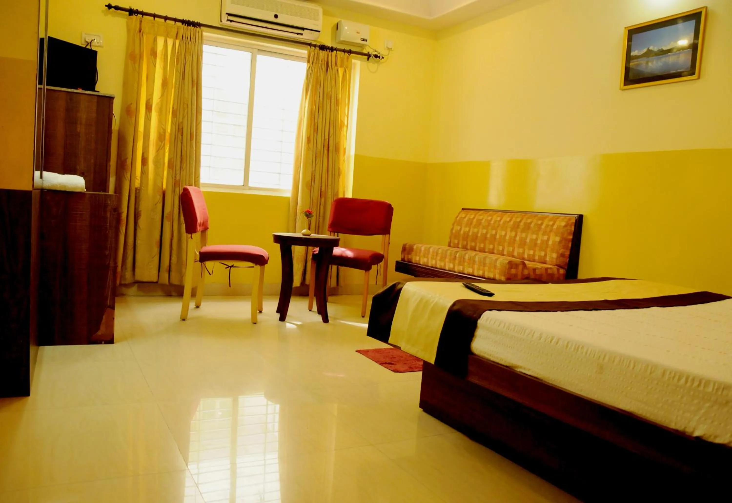 Photo of the whole room, Bed in Suvarna Residency