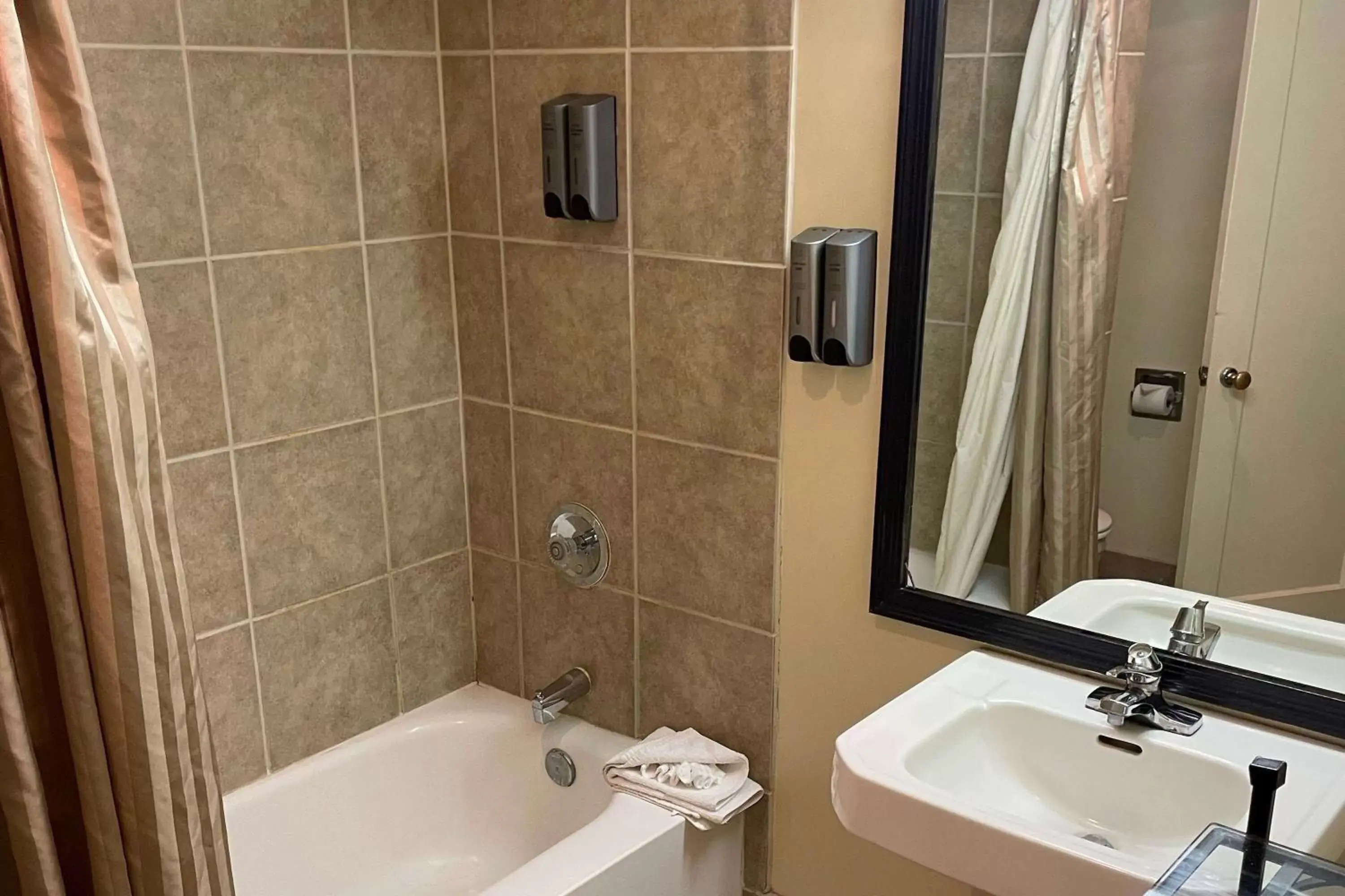 Bathroom in Coronado Motor Hotel, a Travelodge by Wyndham