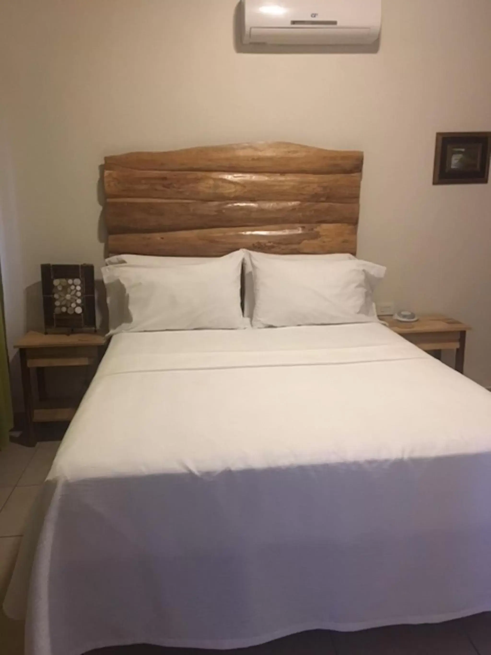Bed in Ten North Tamarindo Beach Hotel