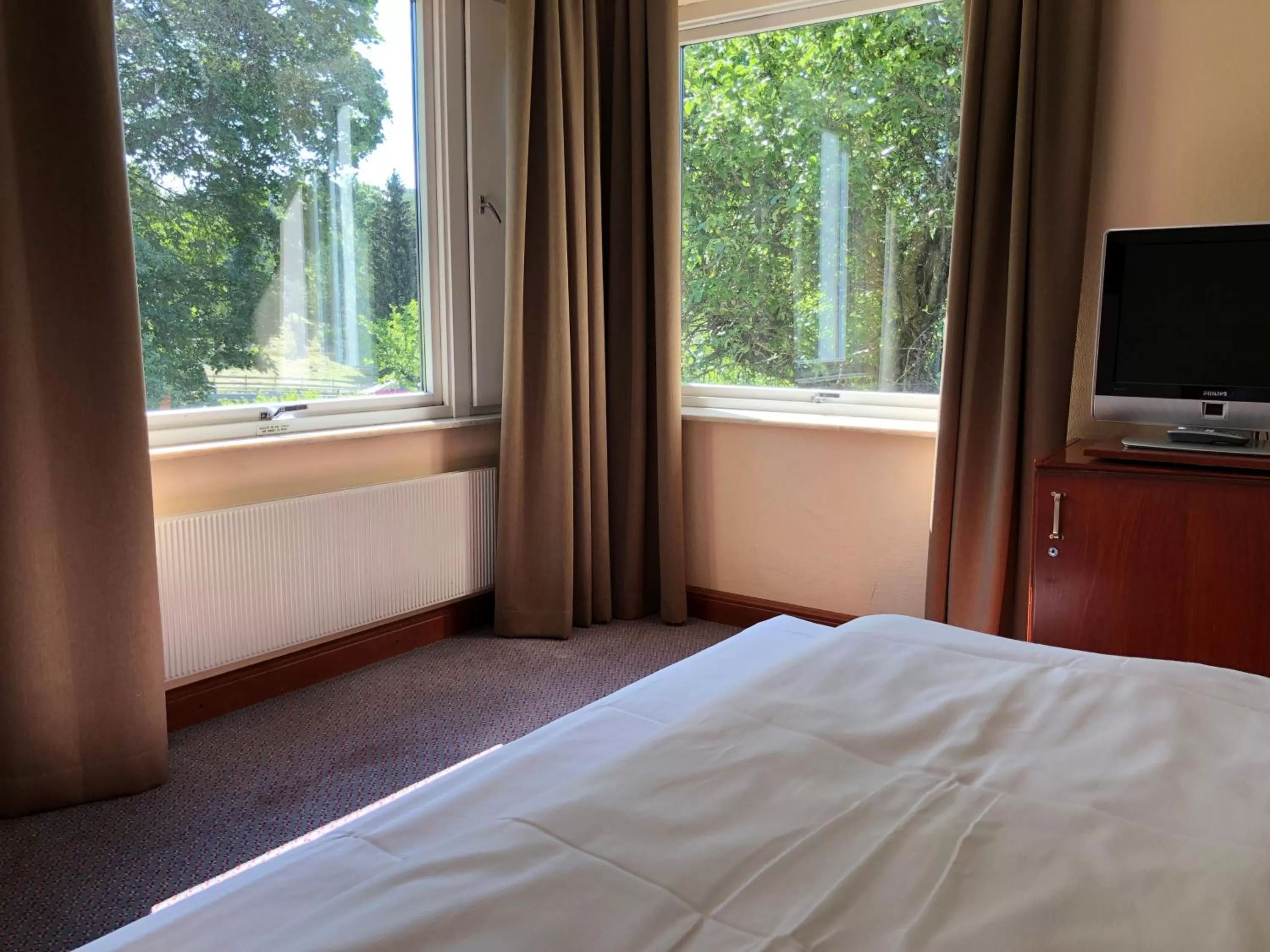 Garden view, Bed in Klækken Hotel