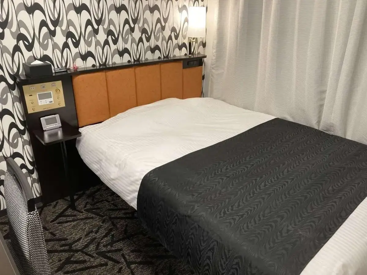 Bed in APA Hotel Beppu Ekimae Bed in APA Hotel Beppu Ekimae