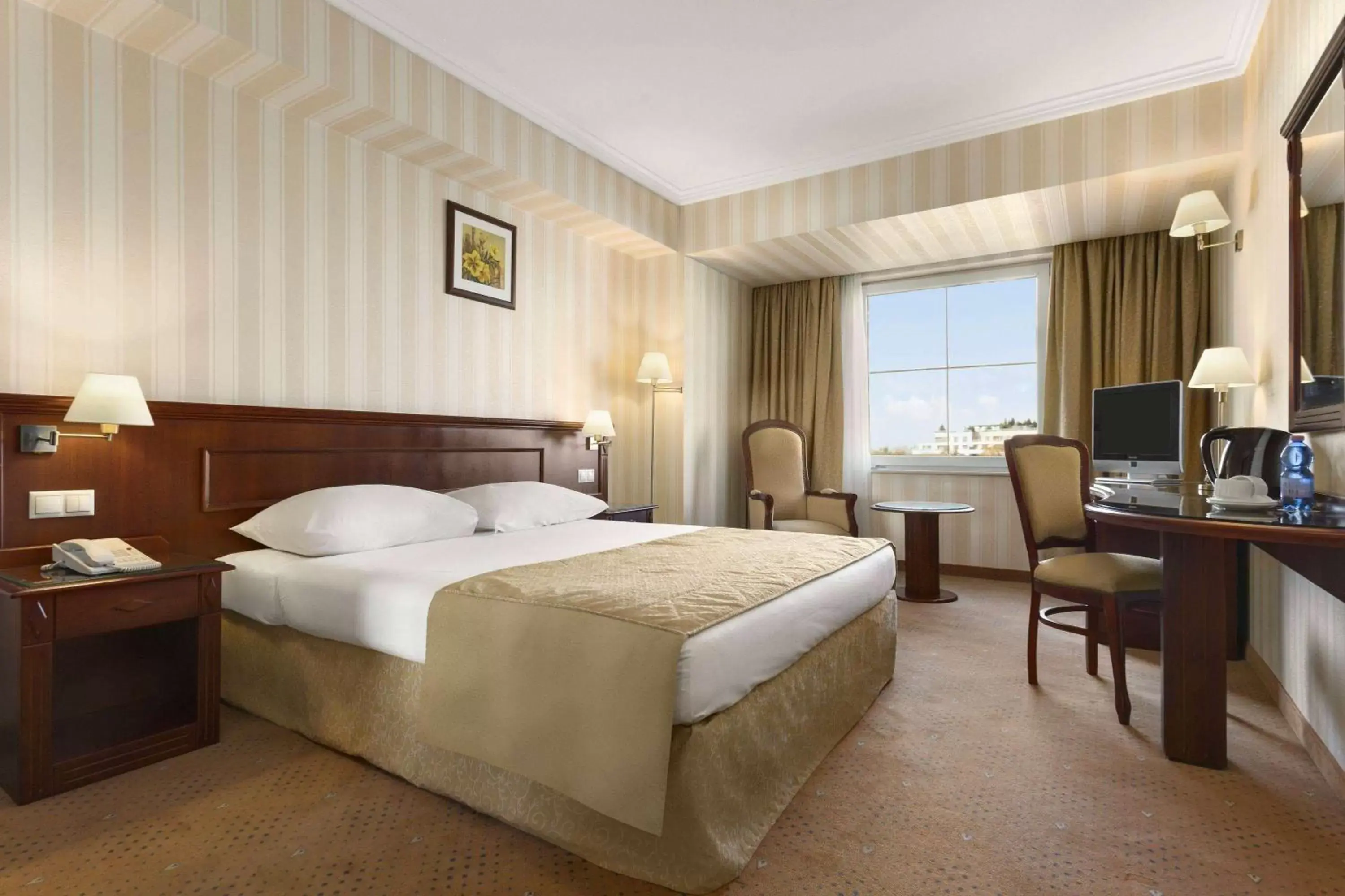 Photo of the whole room, Bed in Ramada Hotel & Suites by Wyndham Bucharest North