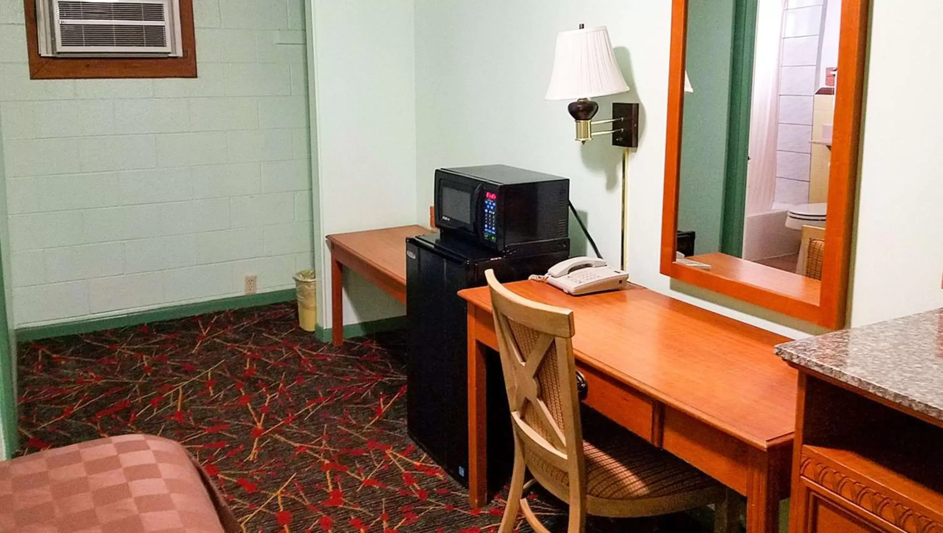 Photo of the whole room, TV/Entertainment Center in American Inn & Suites Childress