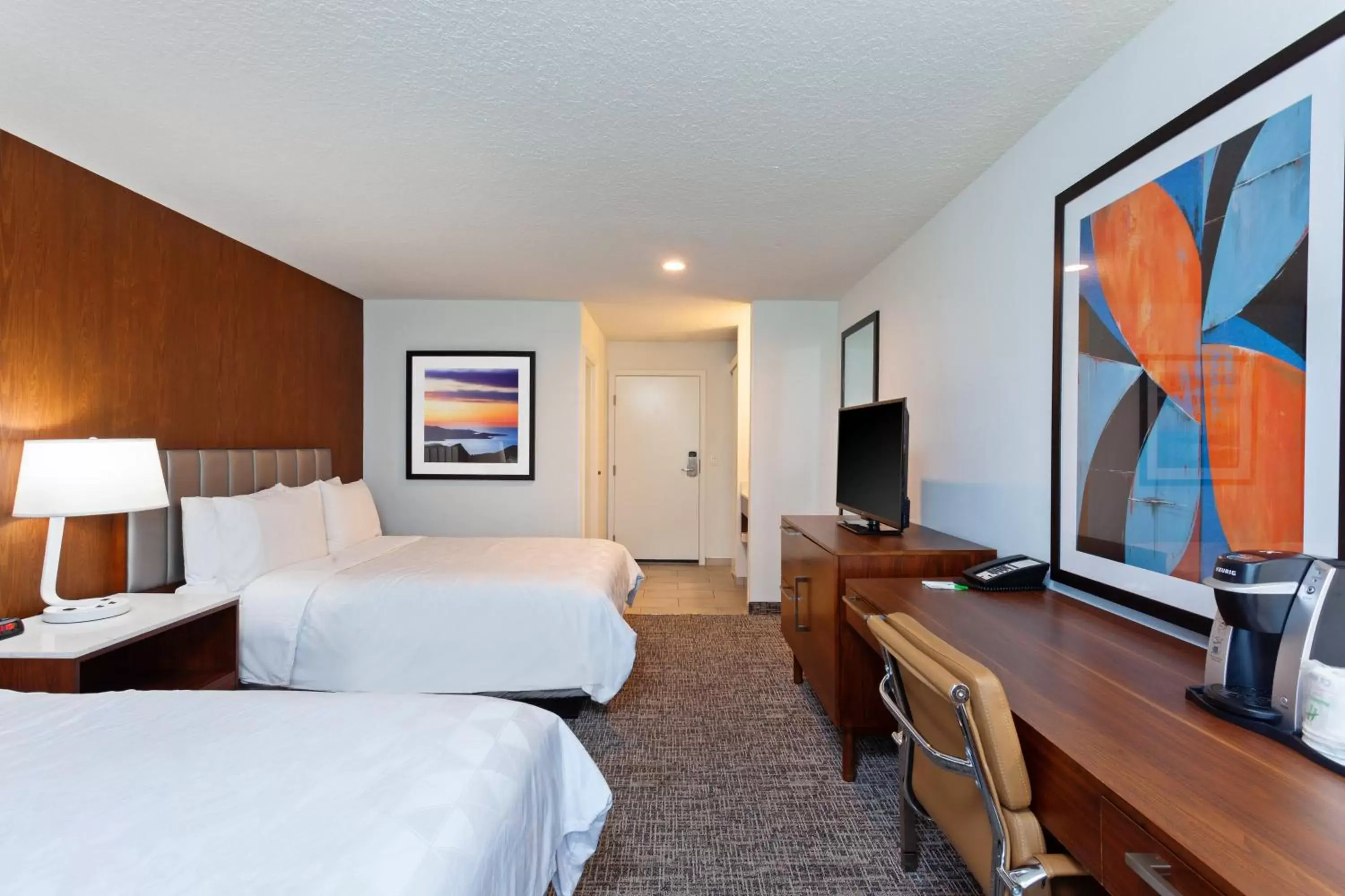 Photo of the whole room, TV/Entertainment Center in Holiday Inn & Suites San Mateo - SFO, an IHG Hotel
