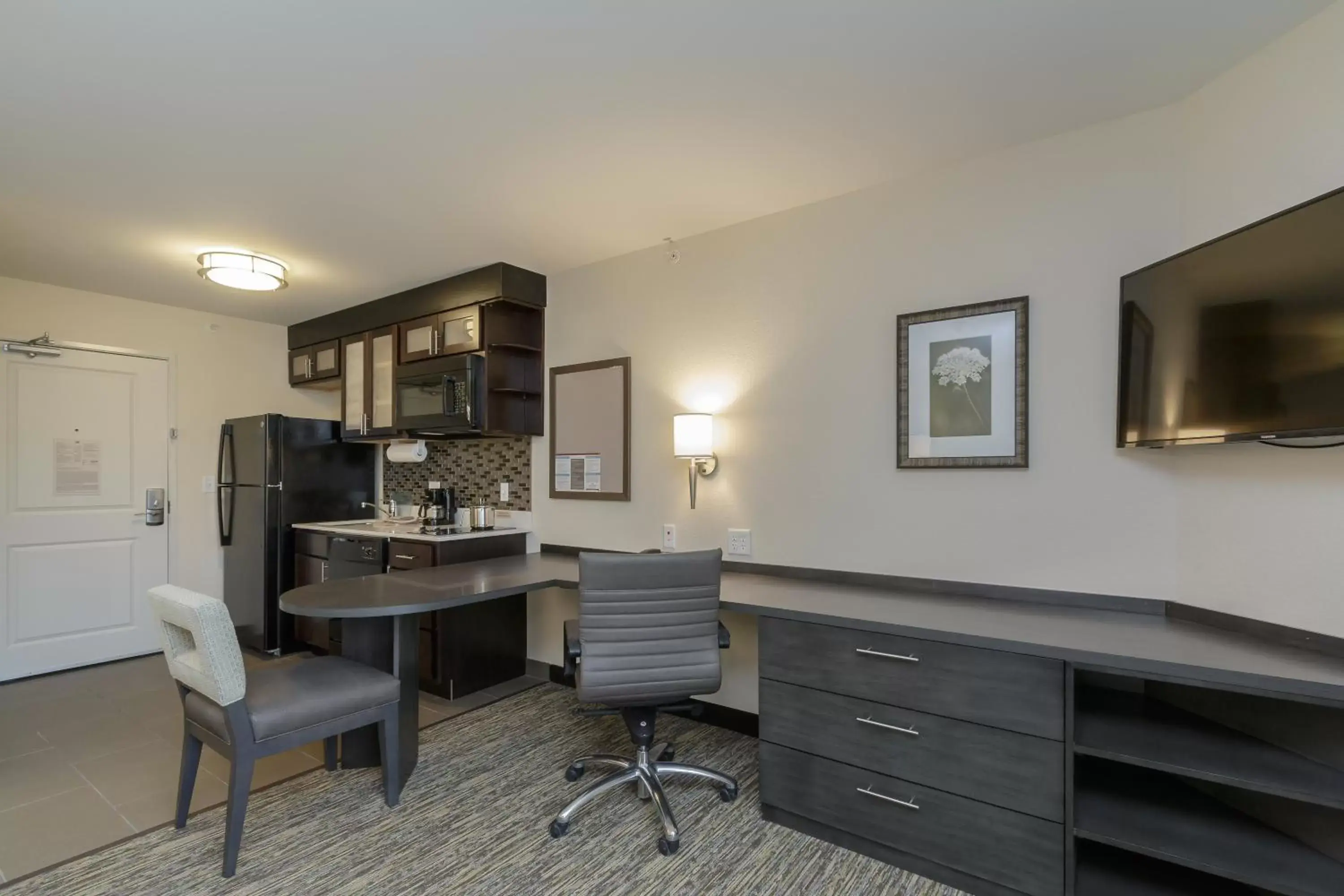 Photo of the whole room, TV/Entertainment Center in Candlewood Suites Mishawaka, an IHG Hotel