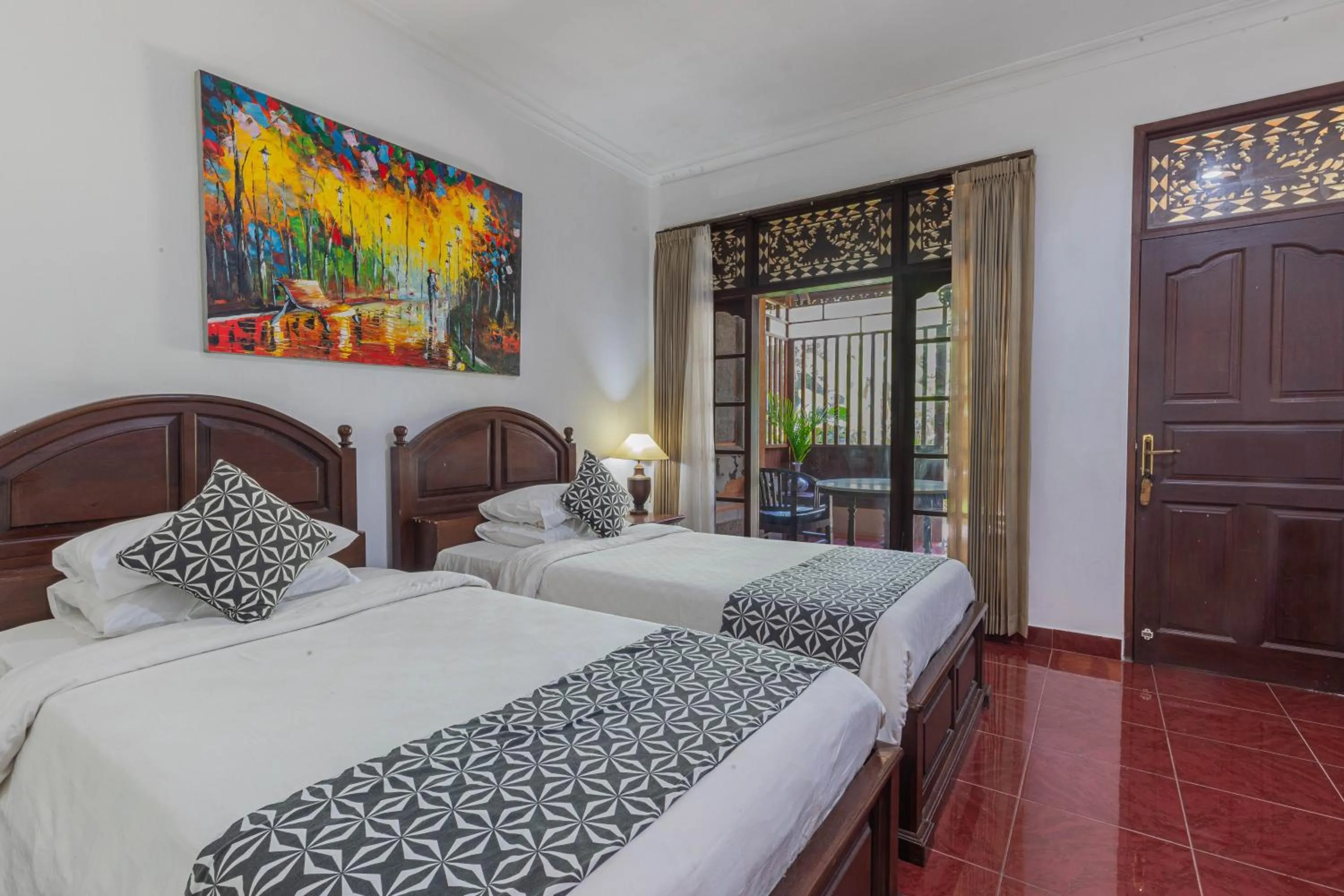 Bed in Puri Mango Guest House Sanur