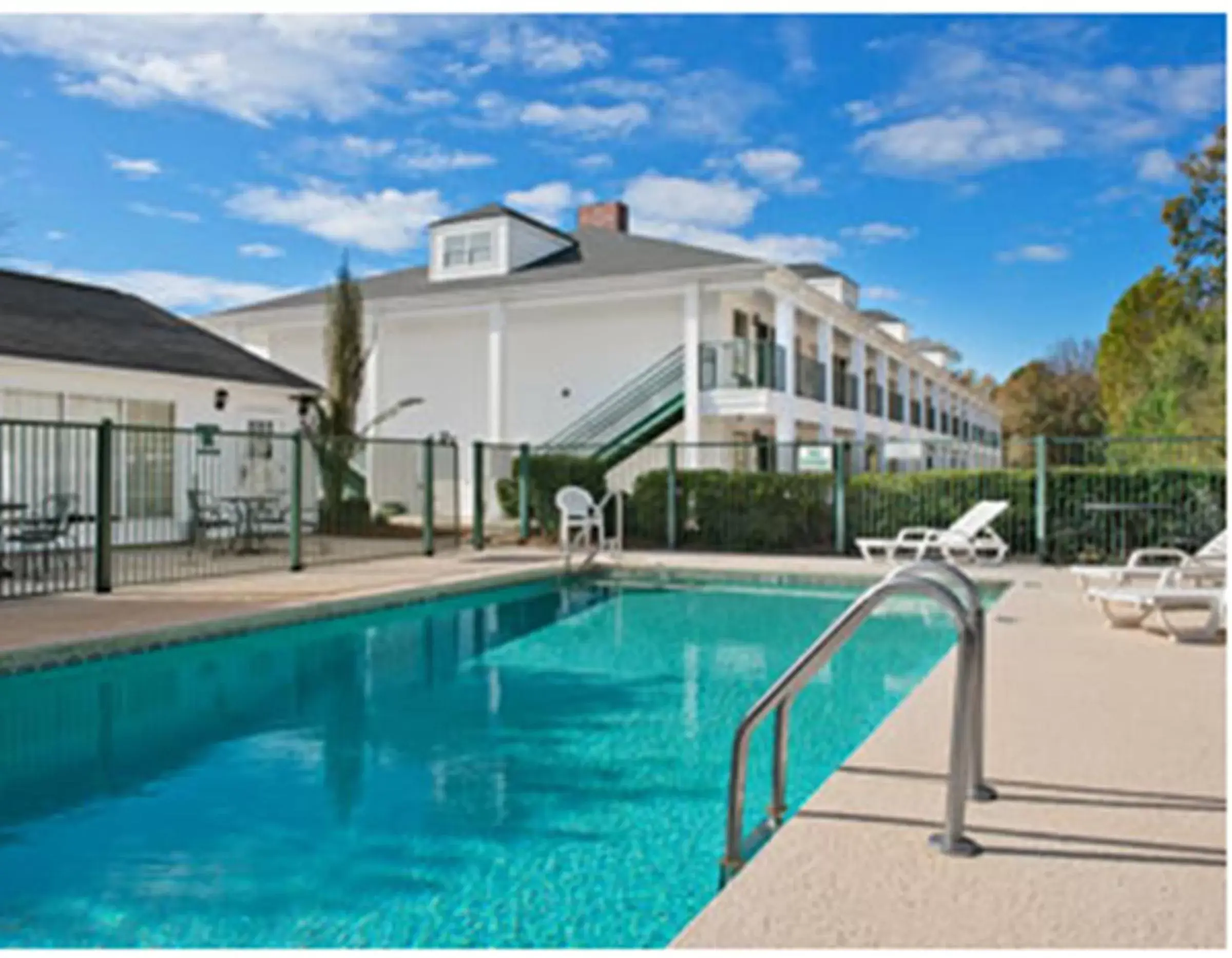 Swimming pool, Property Building in Baymont by Wyndham Roanoke Rapids