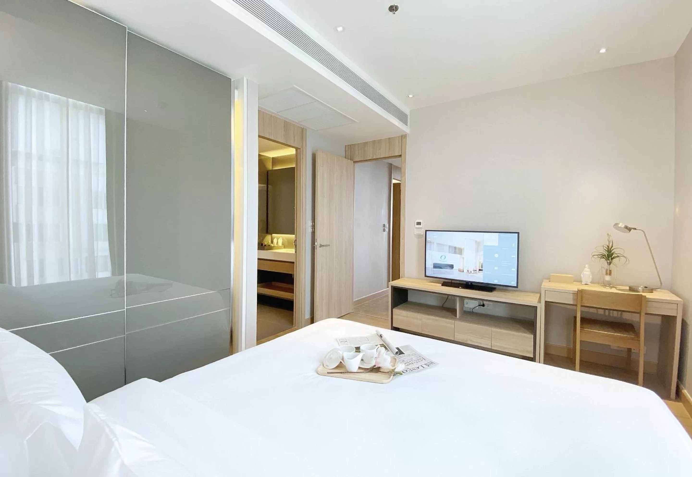 Bed in Oakwood Suites Bangkok