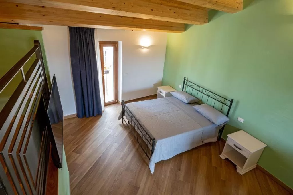 Photo of the whole room, Bed in IL MASCHERONE