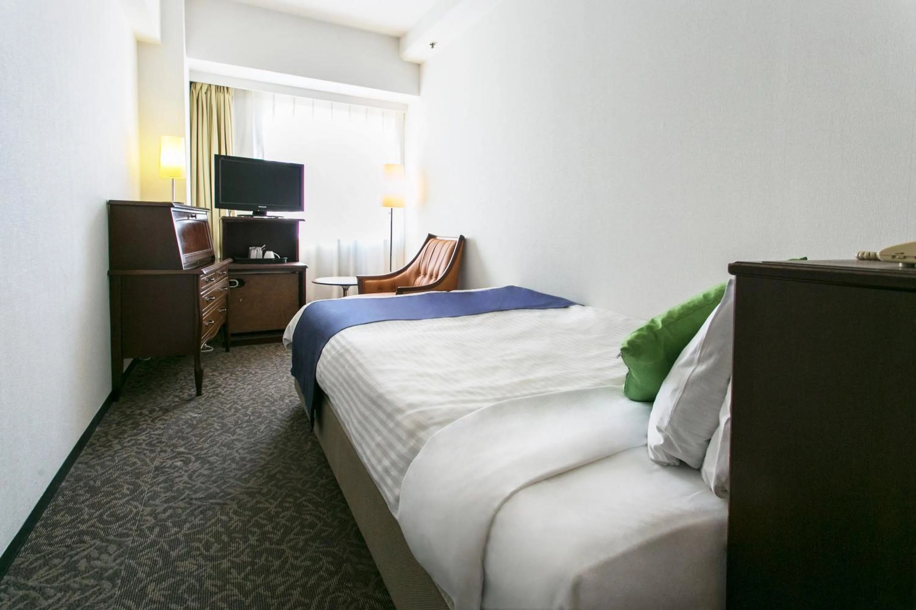 Bed in Kanazawa New Grand Hotel Prestige