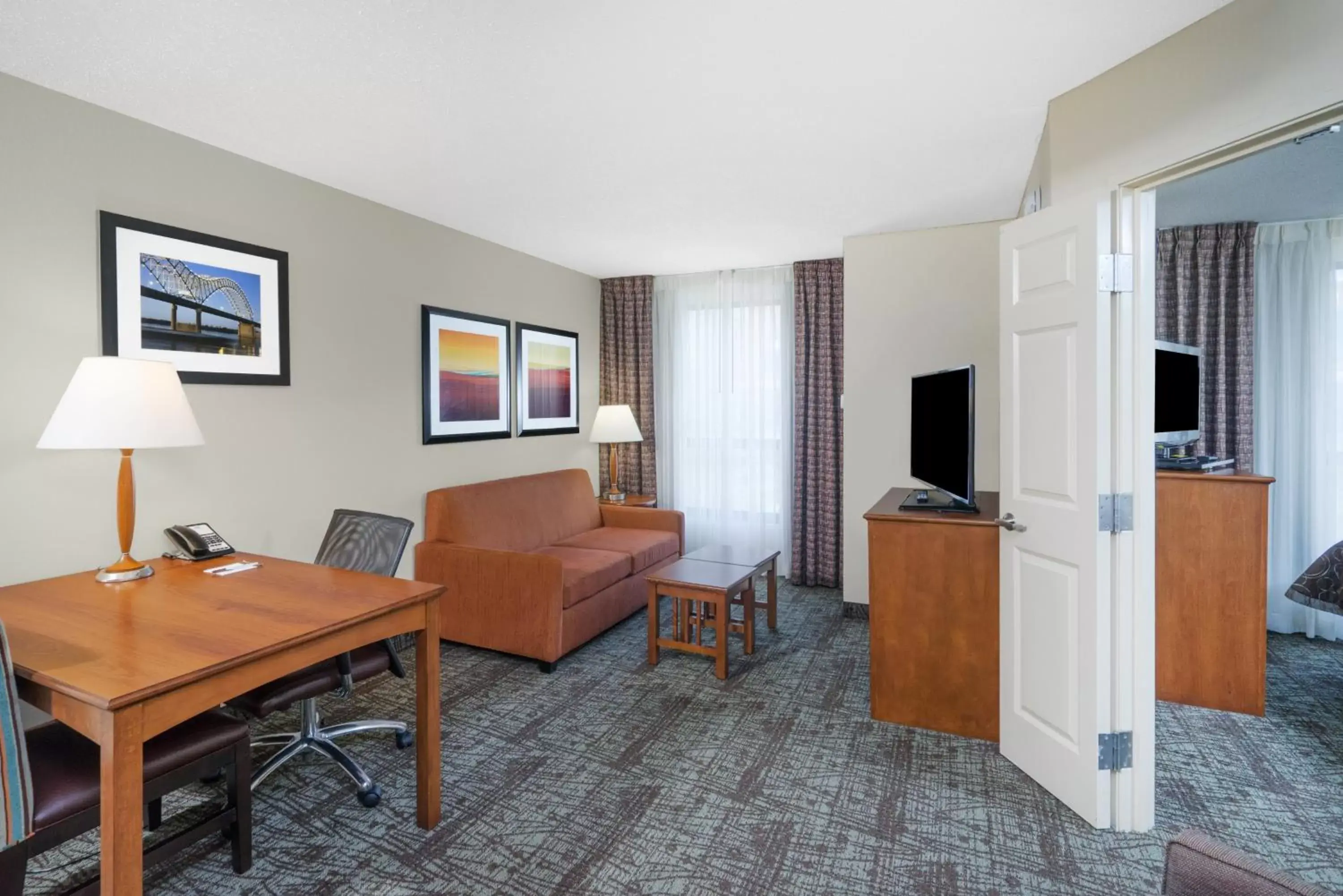 Bedroom, Seating Area in Staybridge Suites Memphis-Poplar Ave East, an IHG Hotel