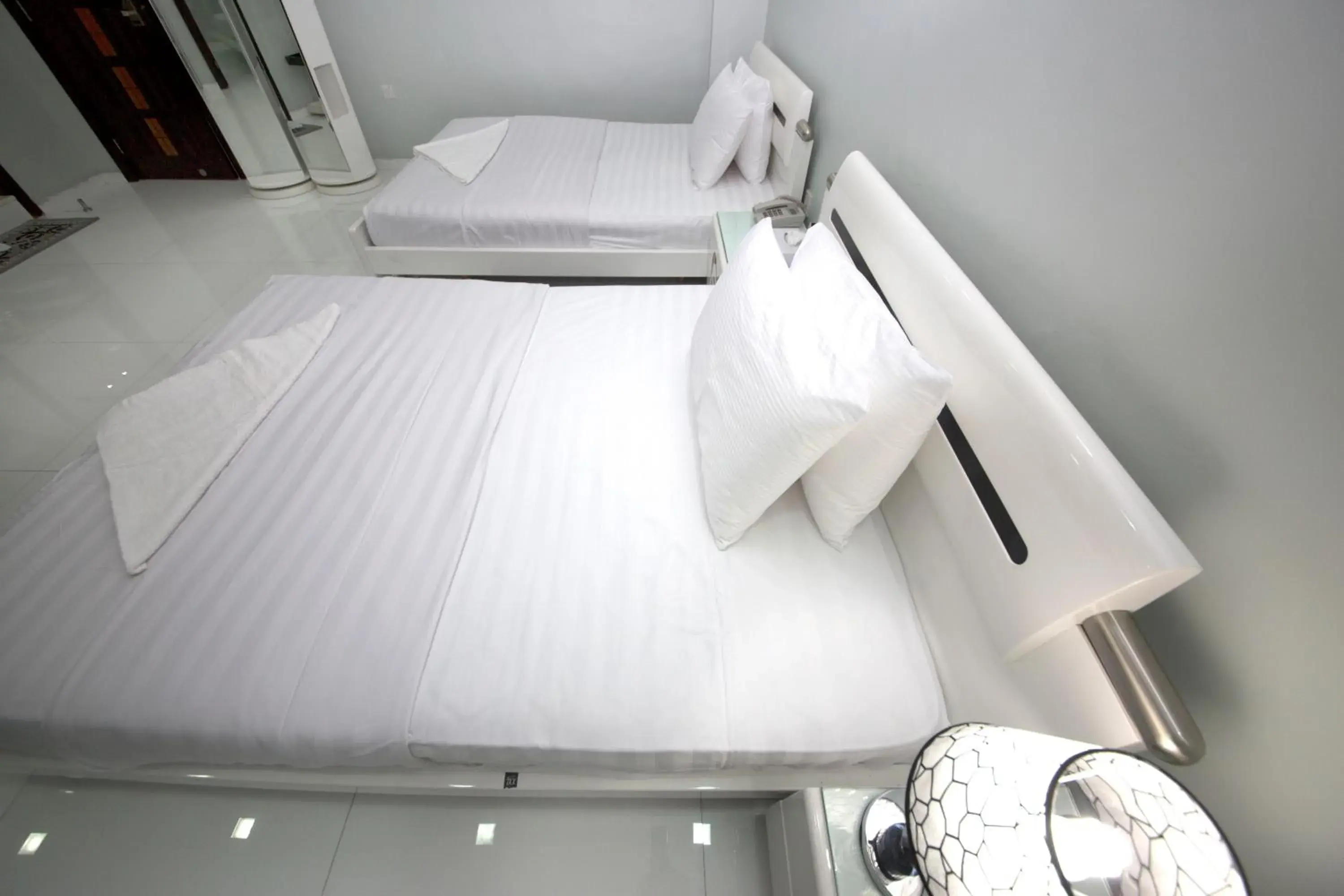 Bed in White Fort Hotel