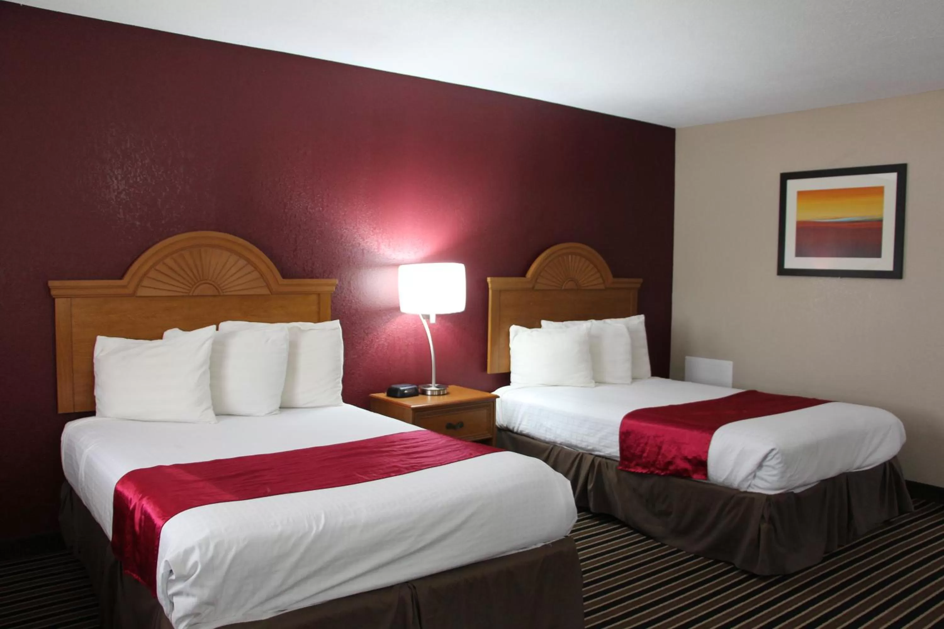 Bed in Westbridge Inn & Suites