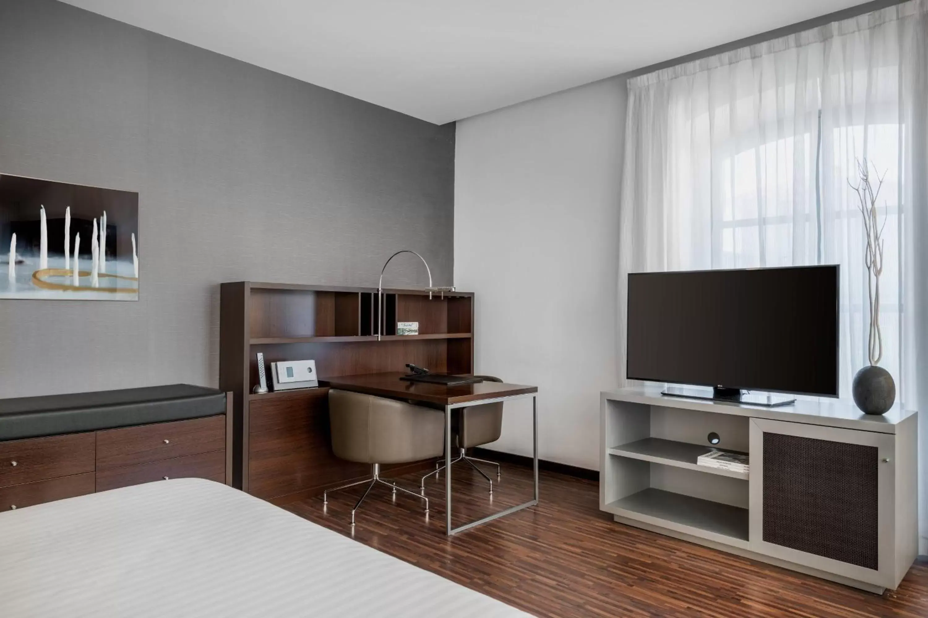 Photo of the whole room, TV/Entertainment Center in AC Hotel Torino by Marriott