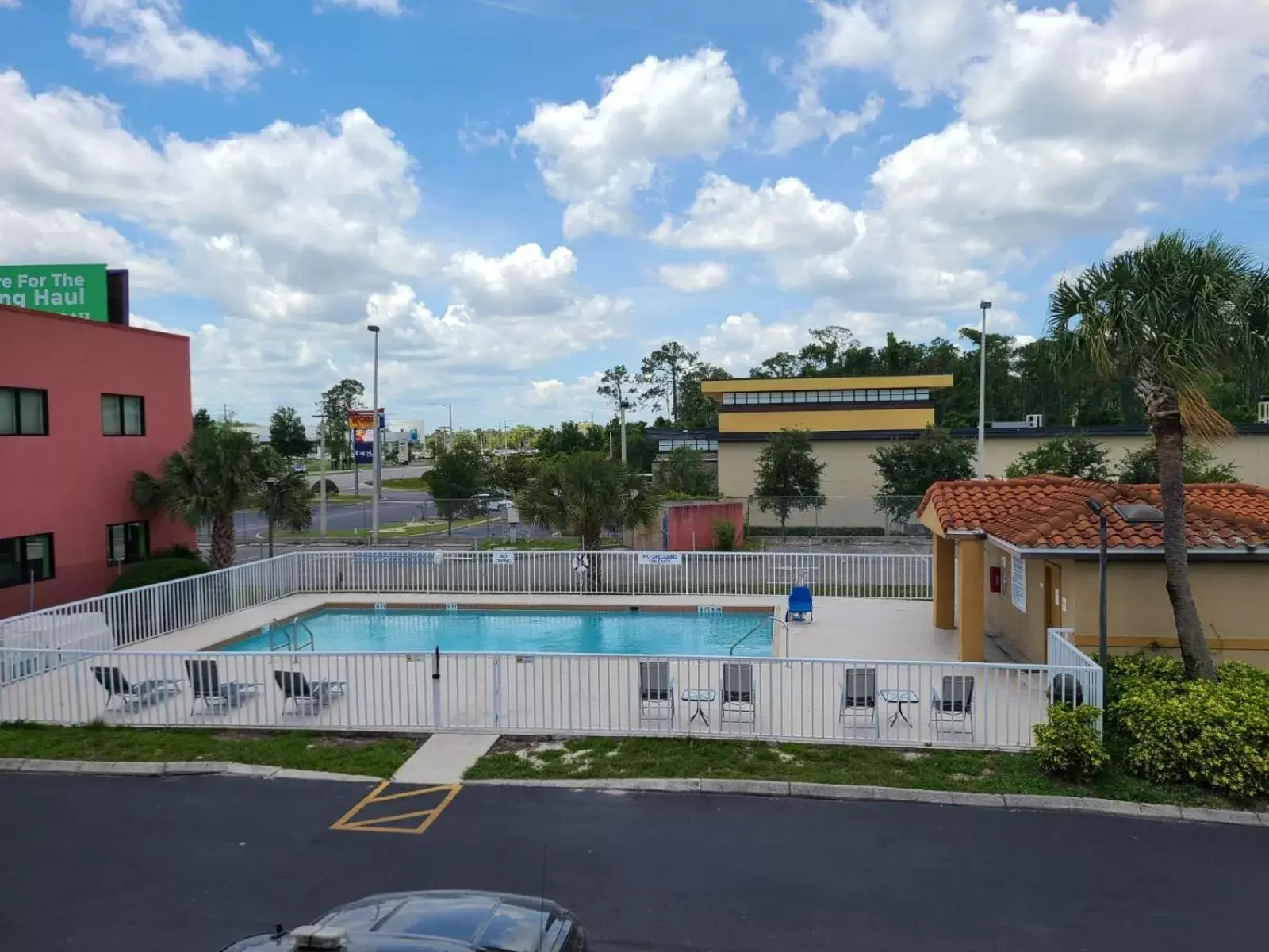 Pool view, Swimming Pool in Days Inn & Suites by Wyndham Orlando East UCF Area