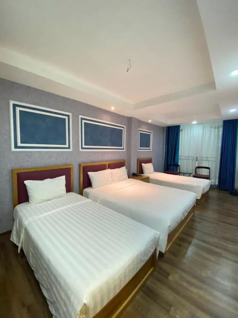 Bed in Holiday Suites Hotel & Spa