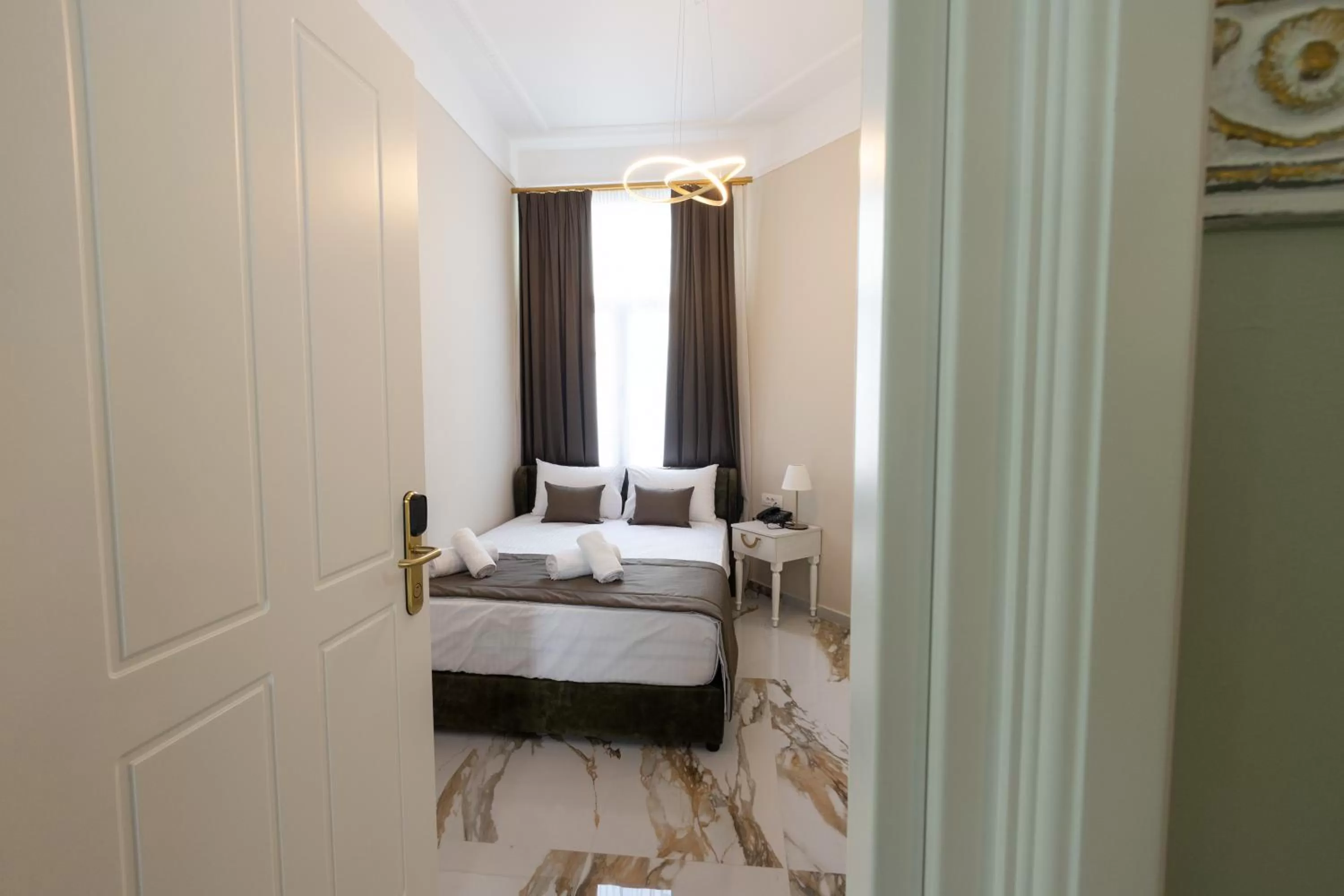 Bed in Modern Revival Luxury Hotel