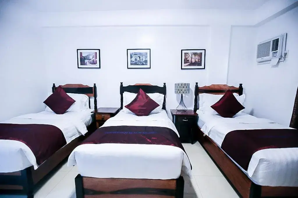 Bed in Doublegem Beach Resort and Hotel
