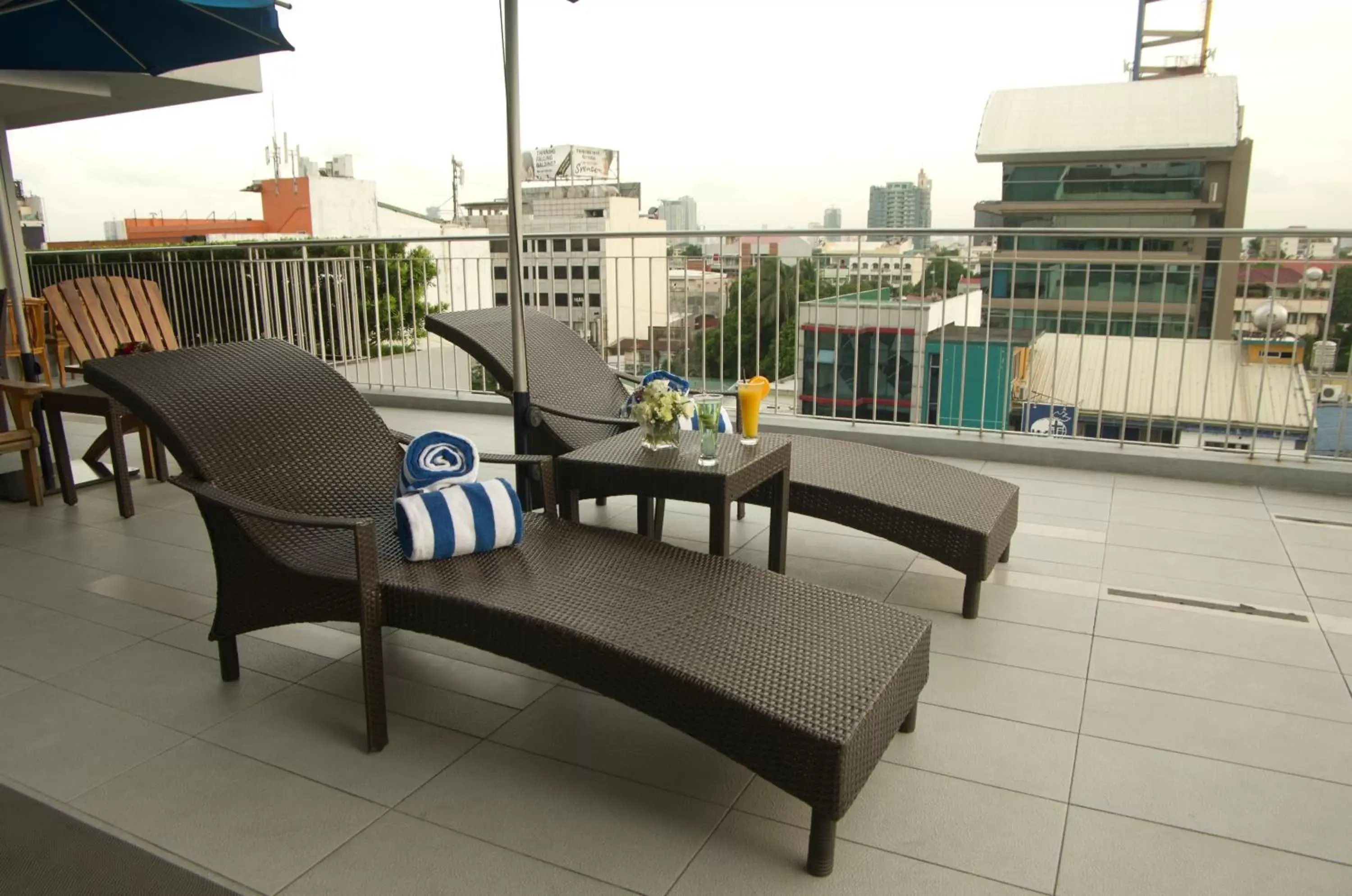 Swimming pool, Balcony/Terrace in Luxent Hotel