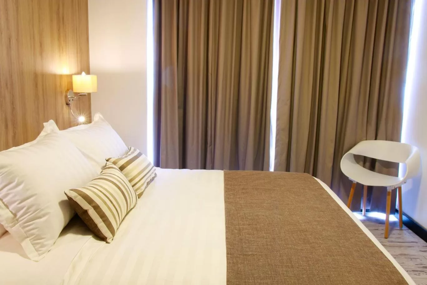 Bed in Urban Suites Apart Hotel