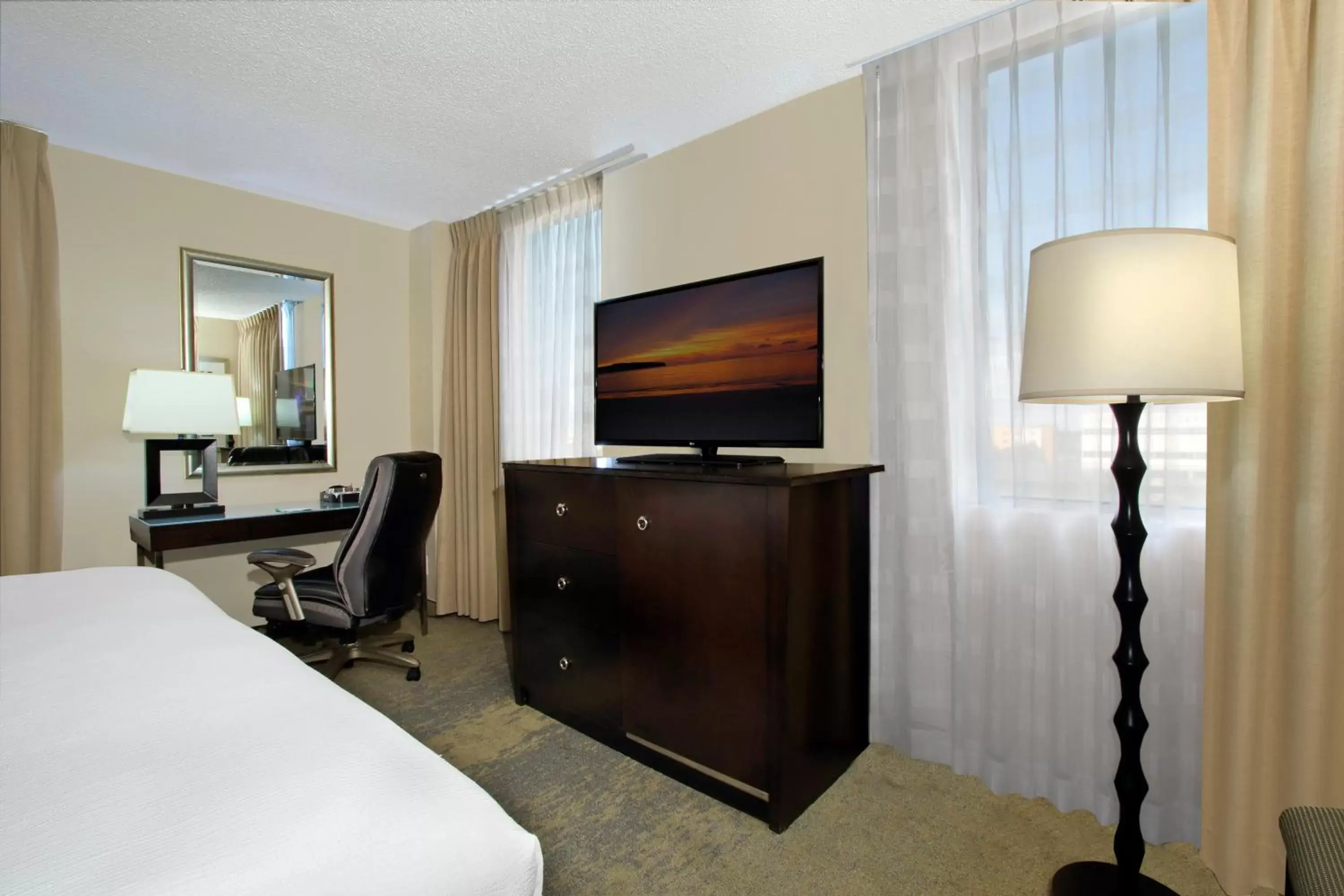Photo of the whole room, TV/Entertainment Center in Holiday Inn Metairie New Orleans, an IHG Hotel
