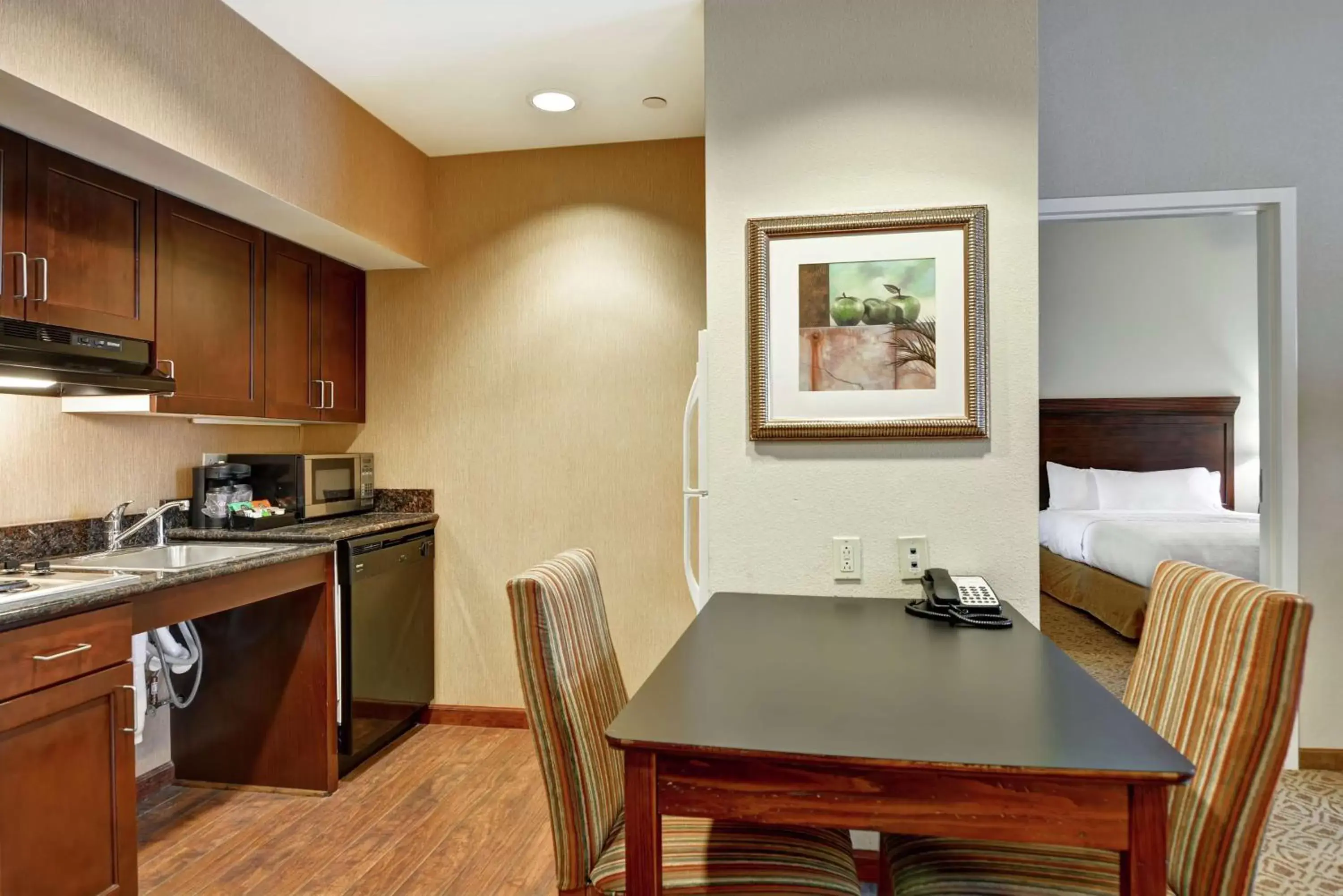 Bedroom, Kitchen/Kitchenette in Homewood Suites Fredericksburg