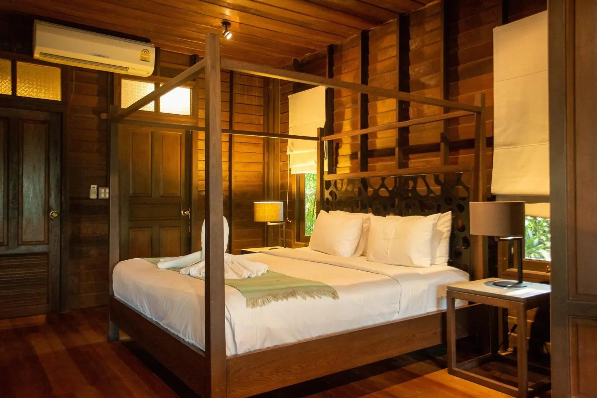 Bed in Baansuanramita Resort