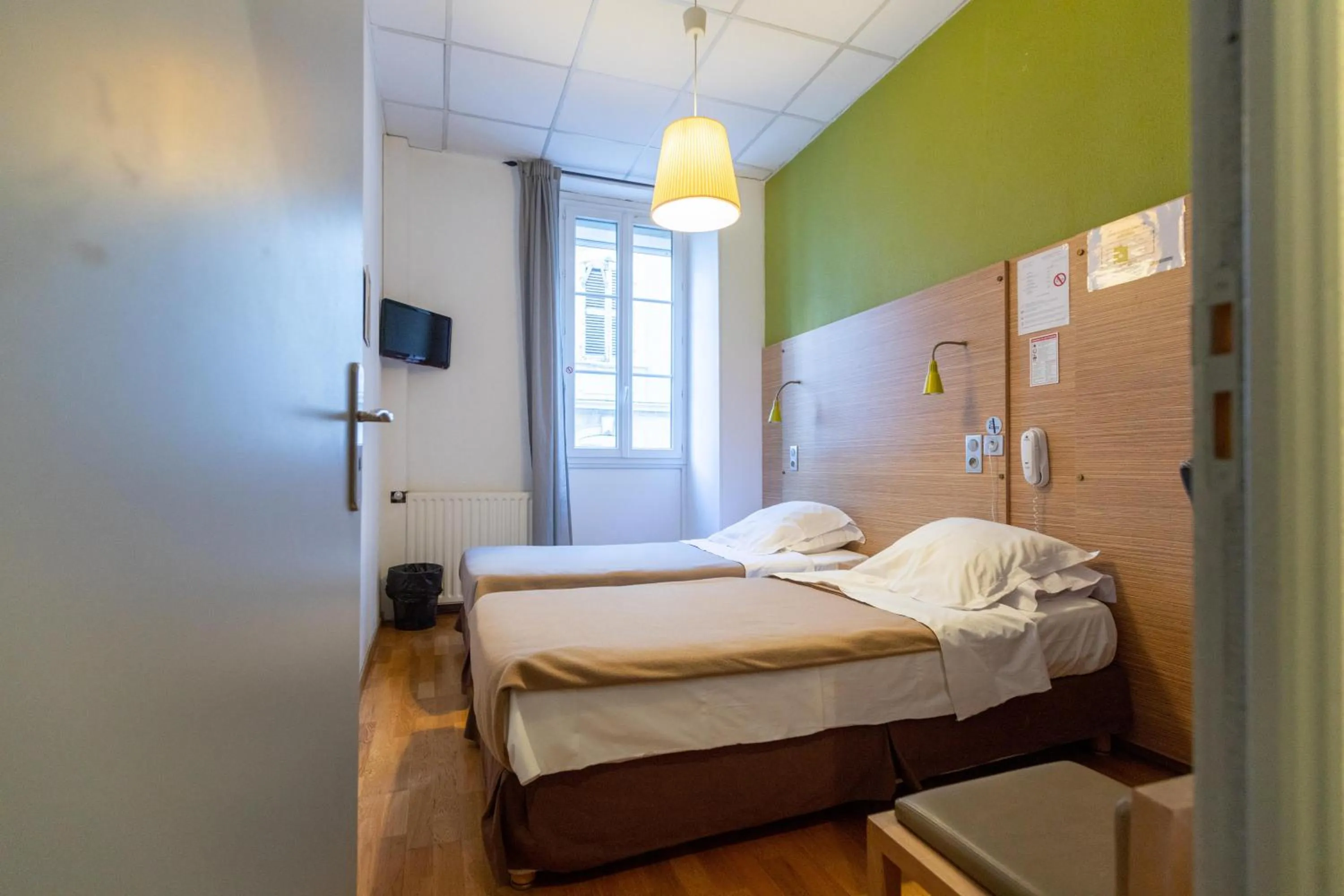 Bed in Hôtel Edmond Rostand